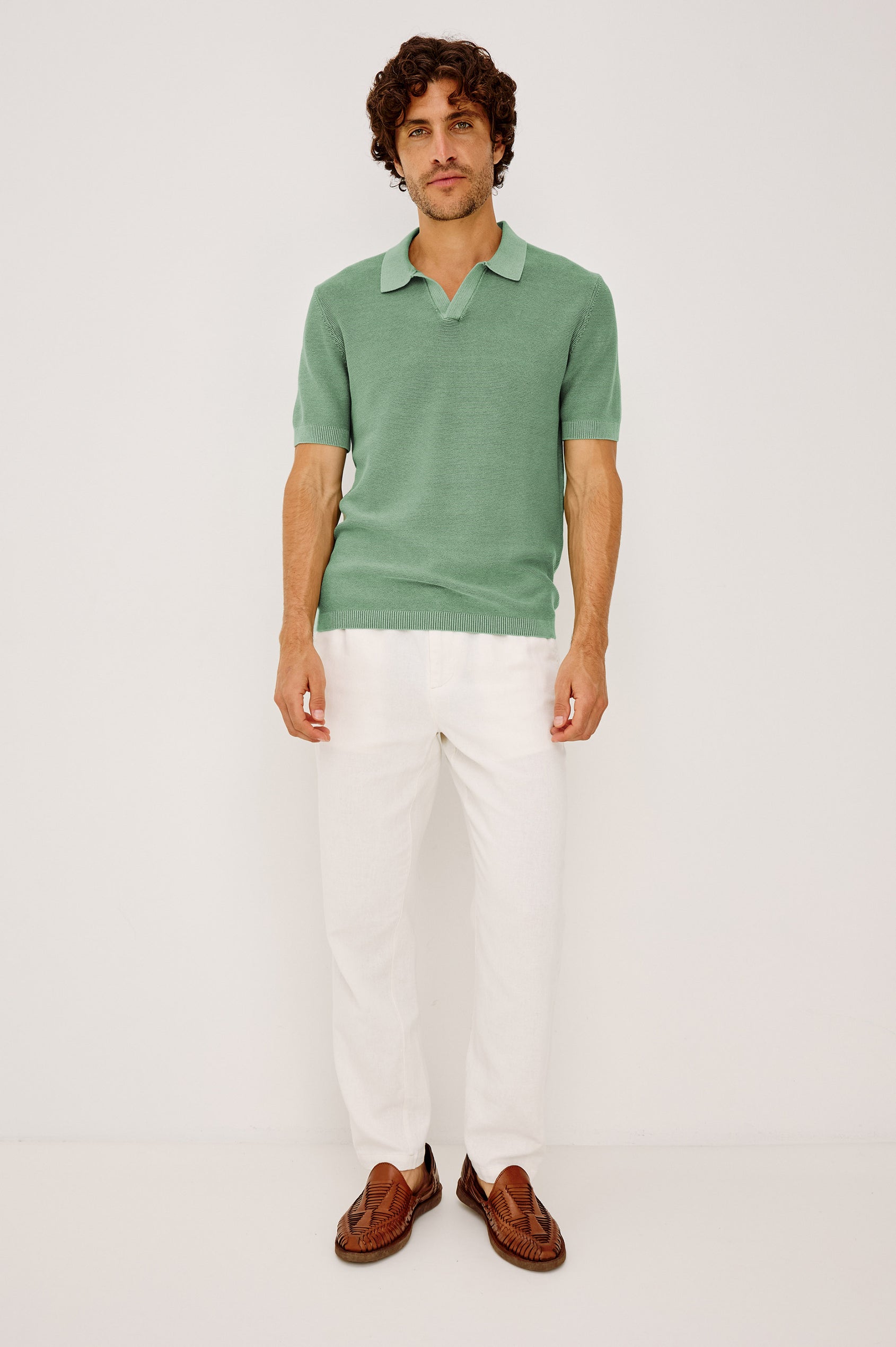 Baker Polo Shirt in Rib Cotton Knit With Colar, Short Sleeves, and Relaxed Fit in Vetiver Colorway - Full Body Front View Featured on Model