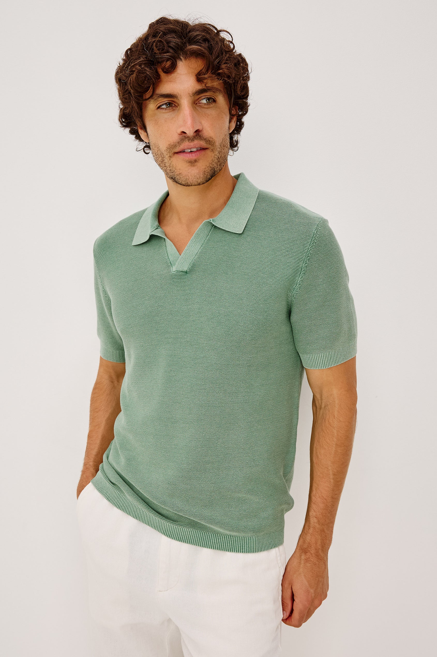 Baker Polo Shirt in Rib Cotton Knit With Colar, Short Sleeves, and Relaxed Fit in Vetiver Colorway - Upper Body Front View Featured on Model
