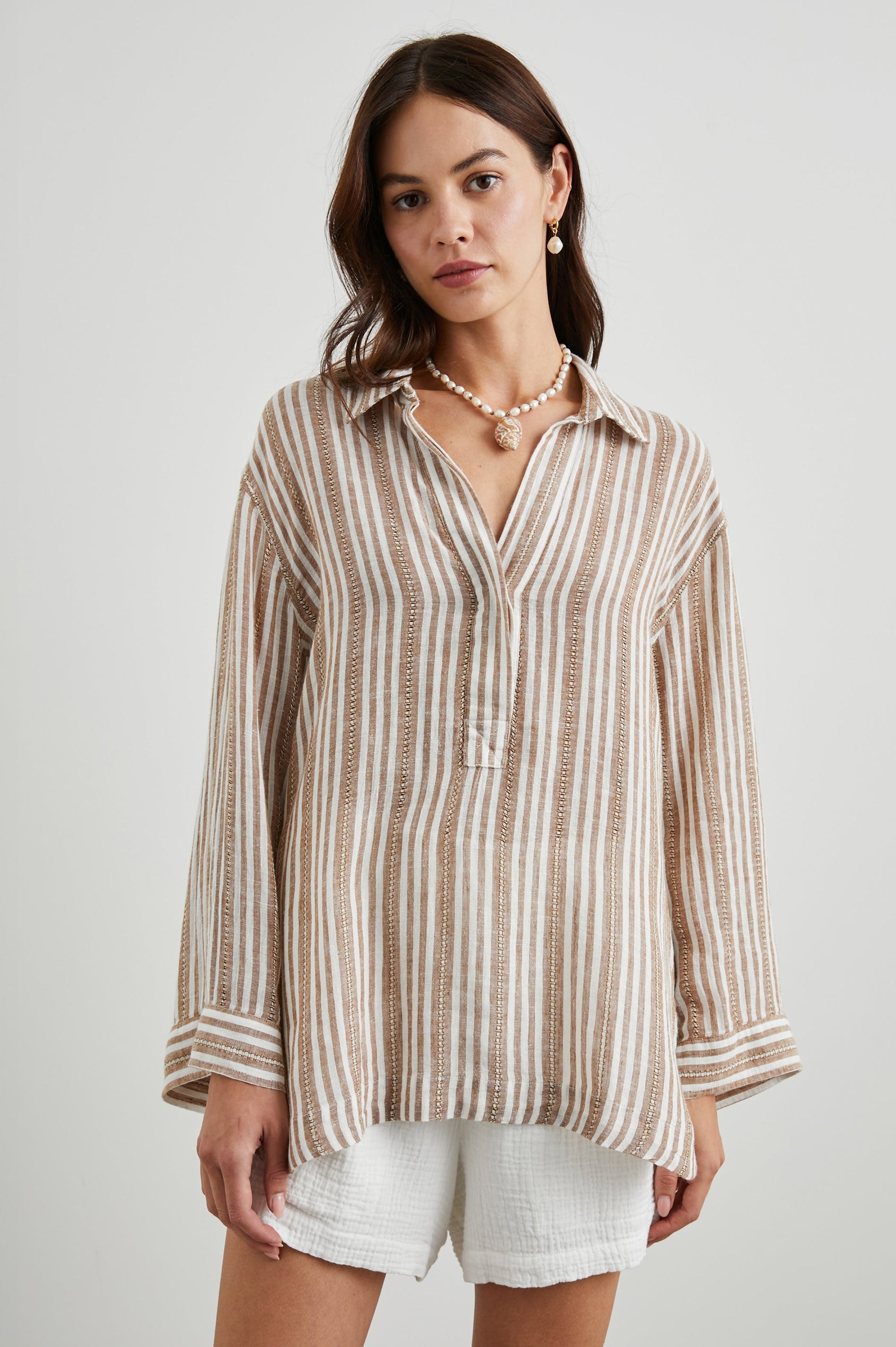 Banks Long-Sleeve Top with Wide Sleeves, a Collar, and a V neck with a Half-Sealed Placket in Palo Santo Stripe Colorway, with Textured Brown and White Vertical Stripes - Front View Featured on Model