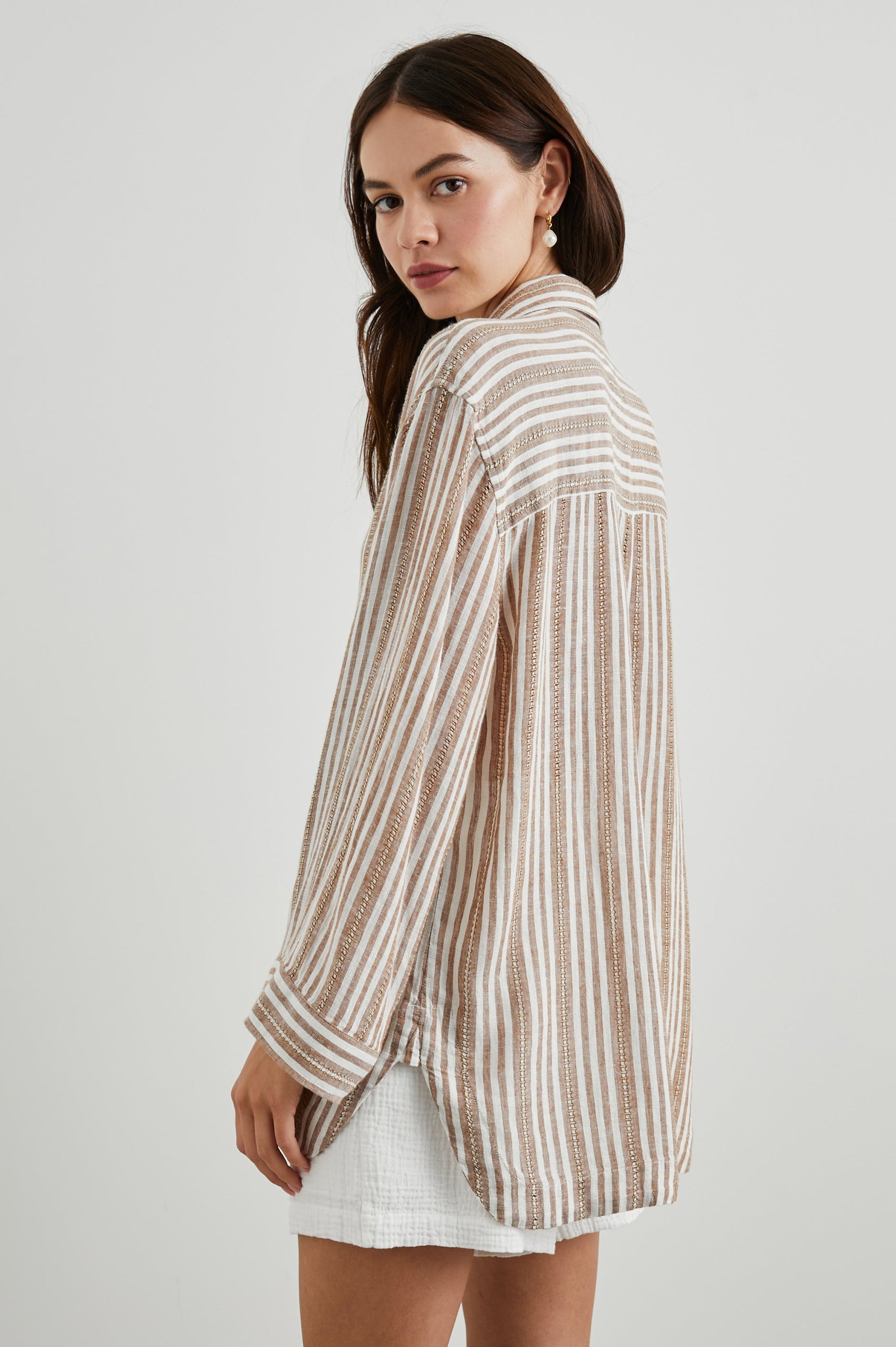 Banks Long-Sleeve Top with Wide Sleeves, a Collar, and a V neck with a Half-Sealed Placket in Palo Santo Stripe Colorway, with Textured Brown and White Vertical Stripes - Back View Featured on Model