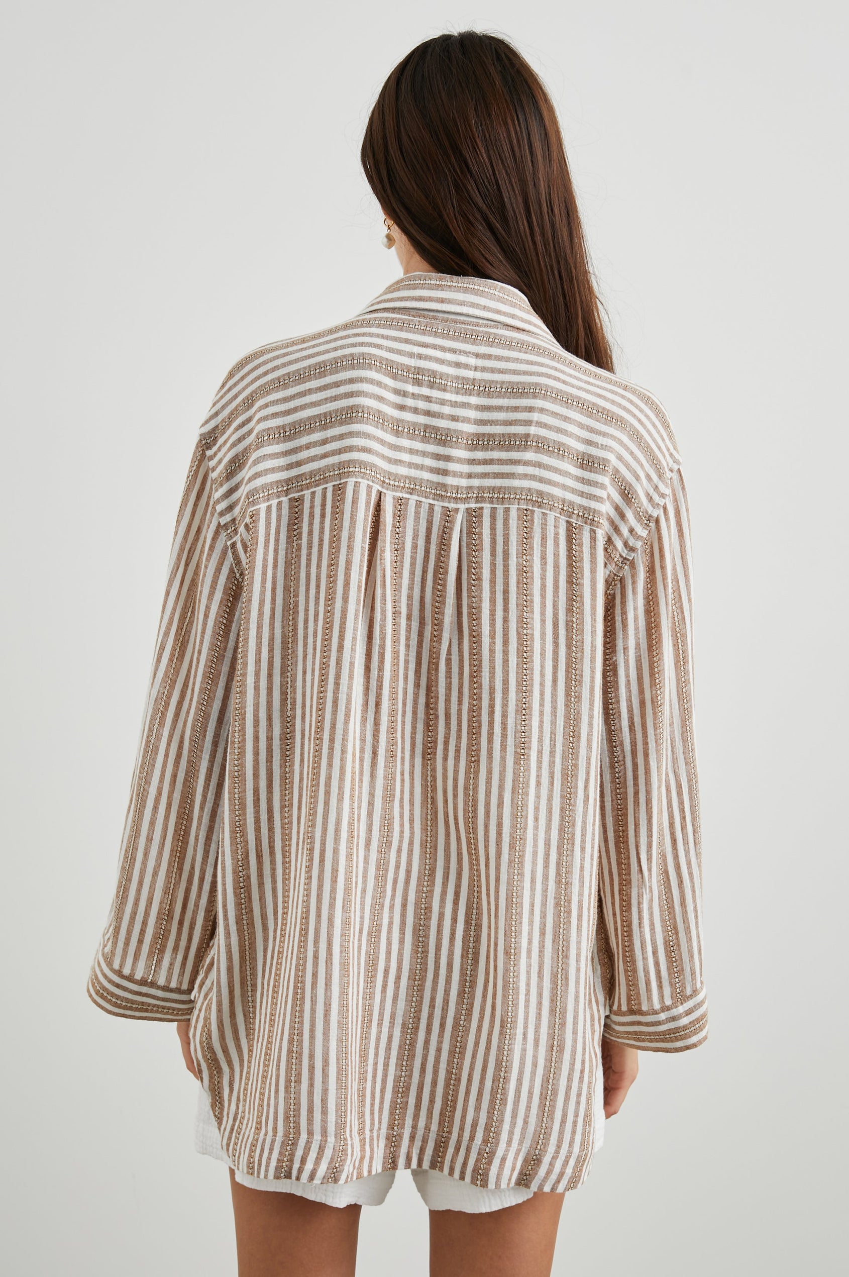 Banks Long-Sleeve Top with Wide Sleeves, a Collar, and a V neck with a Half-Sealed Placket in Palo Santo Stripe Colorway, with Textured Brown and White Vertical Stripes - Back View Featured on Model