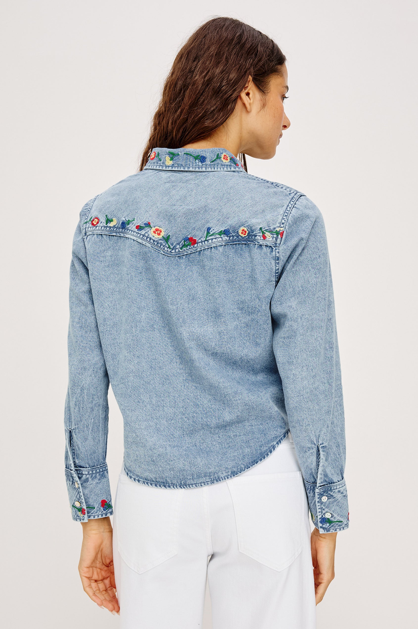 Bari Shirt in Cotton Chambray With Collar, Front Buttons, and Long Sleeves in Indigo Floral Embroidery Colorway - Upper Body Back VIew Featured on Model