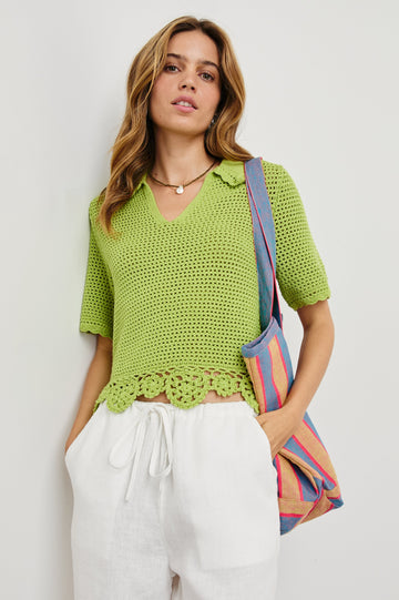 Striped linen Beach Tote with front pocket and long, wide shoulder straps in Rio Stripe - front view of model with bag over shoulder