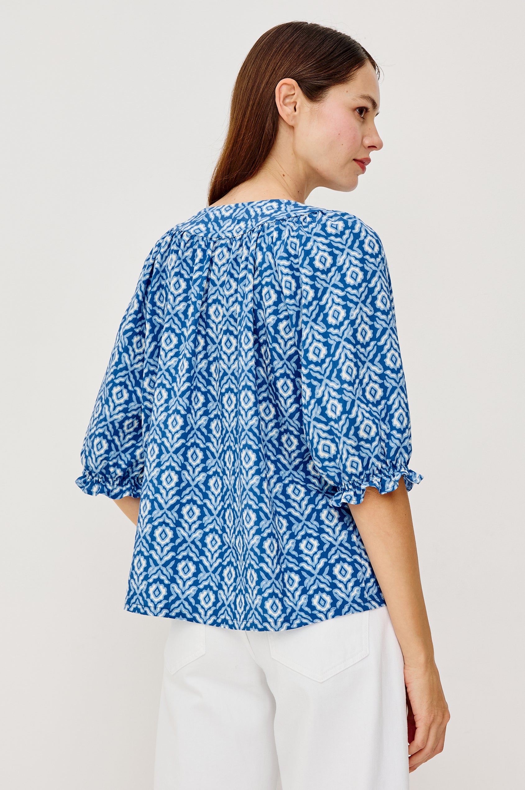 Belina Top With Gathrered V-Neck With Self-Ties Elbow Length Sleeves in Blue Ikat Colorway - Upper Body Back View Featured on Model