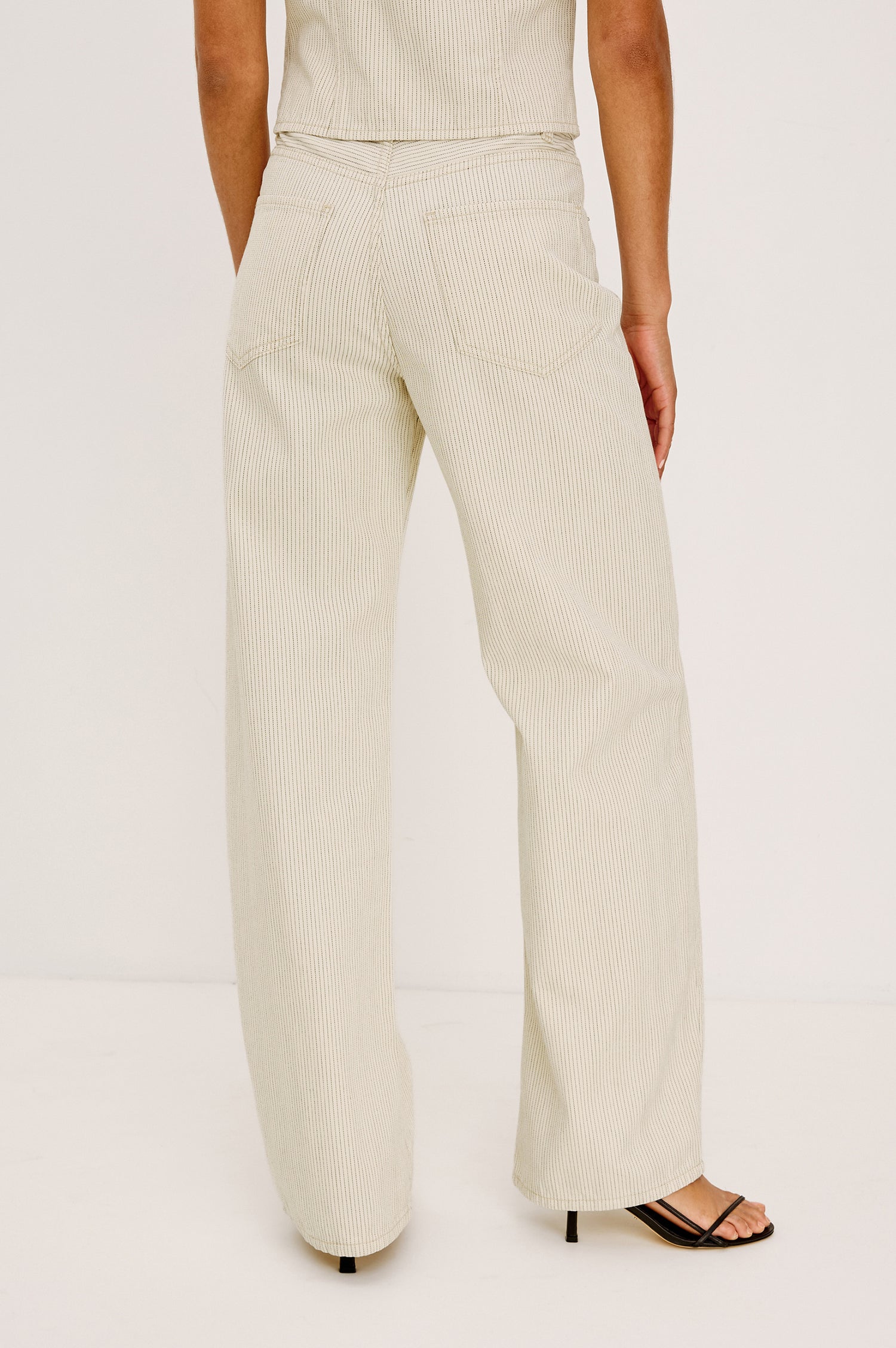 Belmont Arc Leg Jean in Rigid Denim With High-Waisted Fit, Button Fly, and 32″ Inseam in Ecru Railroad Stripe Colorway - Lower Body Back View Featured on Model