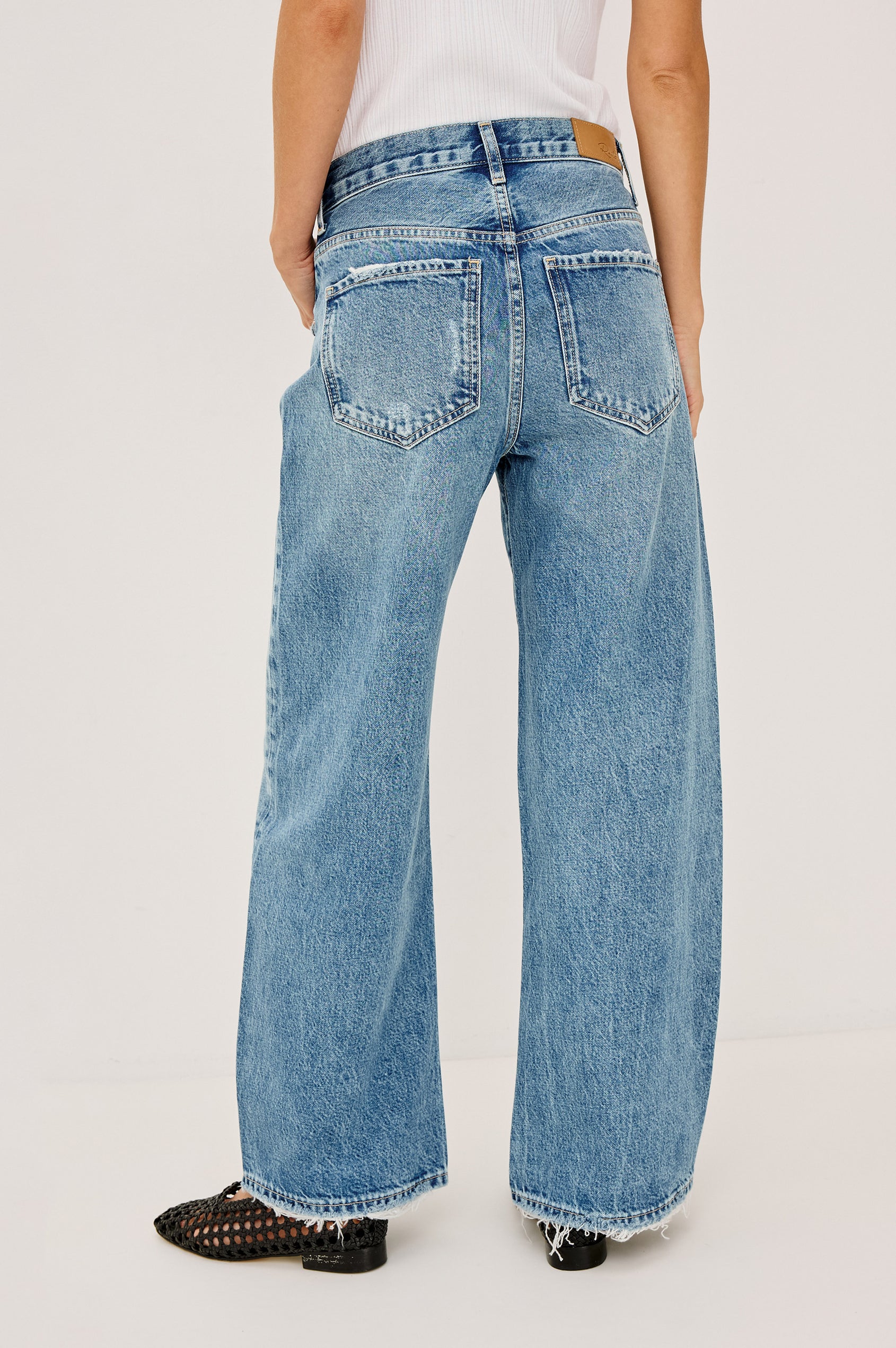 Belmont Arc Leg Jean in Rigid Denim With High-Waisted Fit, Button Fly in Authentic Stone Colorway - Back View Featured on Model