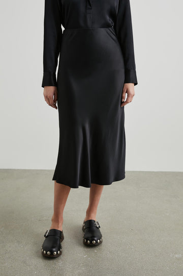Berlin Midi Skirt in Black Colorway - Front View Featured on Model
