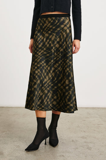 Berlin Midi Skirt in Cypress Colorway, a Black and Cypress Pattern - Front View Featured on Model