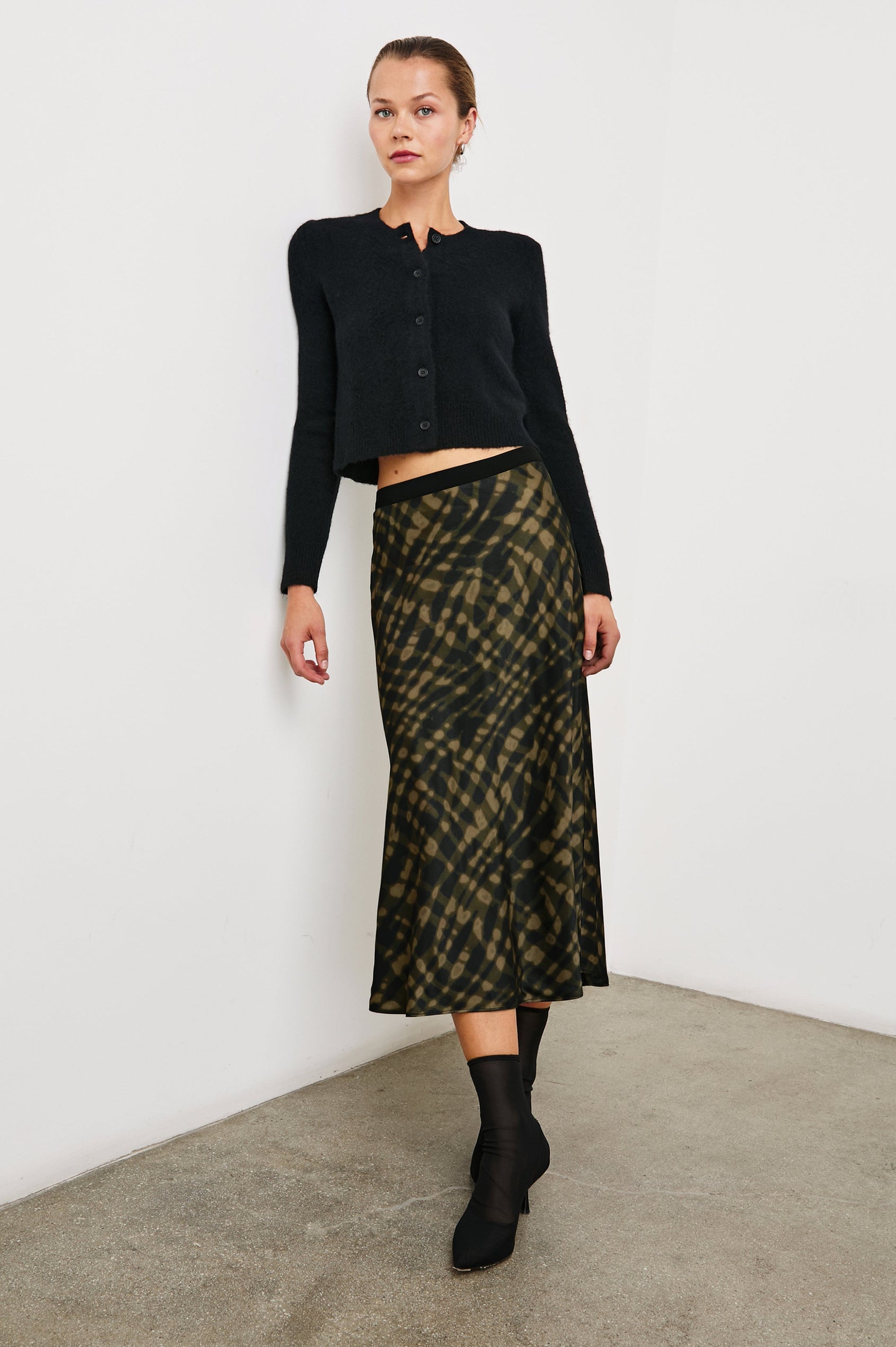 Berlin Midi Skirt in Cypress Colorway, a Black and Cypress Pattern - Front Full Body View Featured on Model