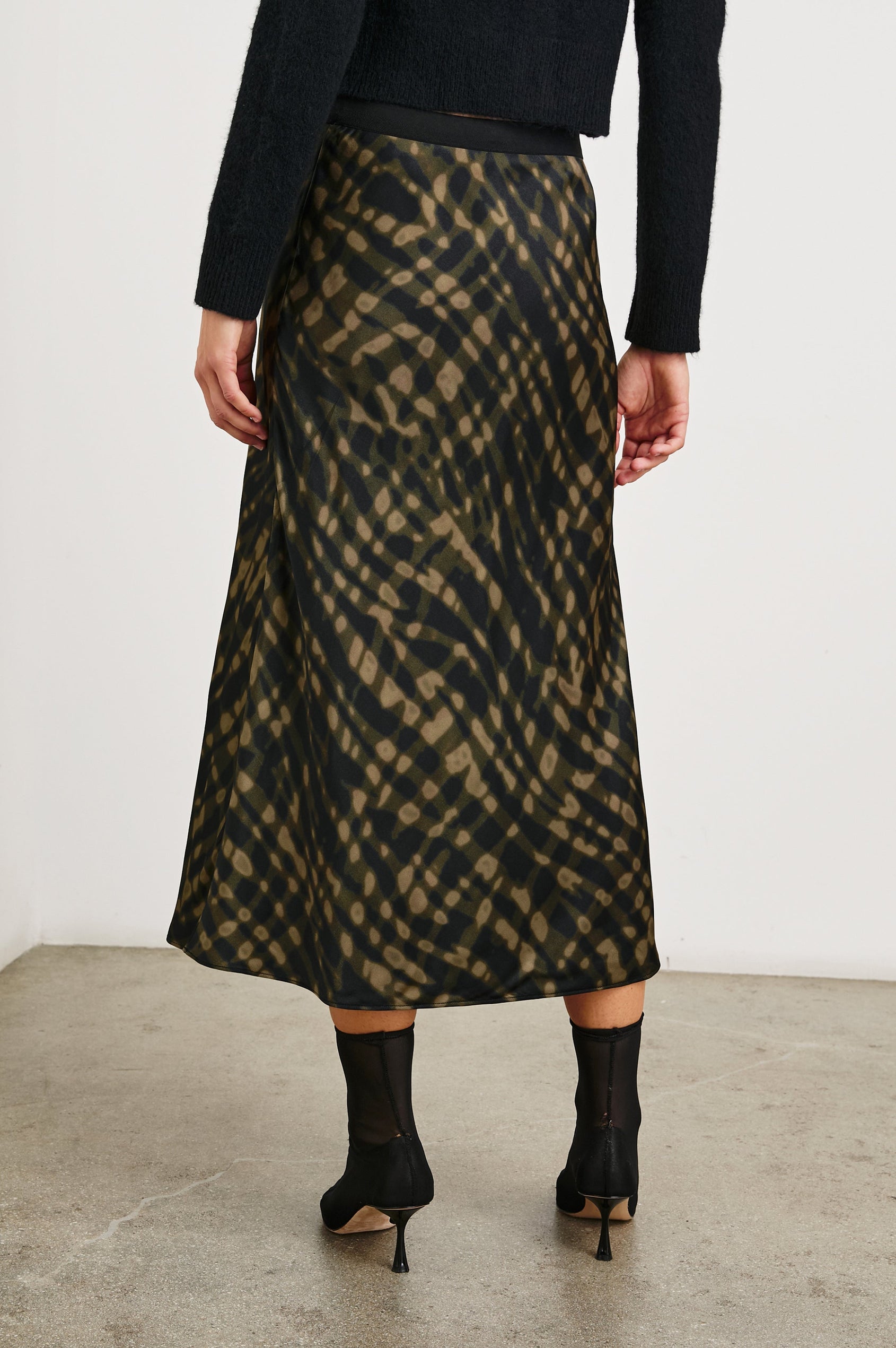 Berlin Midi Skirt in Cypress Colorway, a Black and Cypress Pattern - Back View Featured on Model