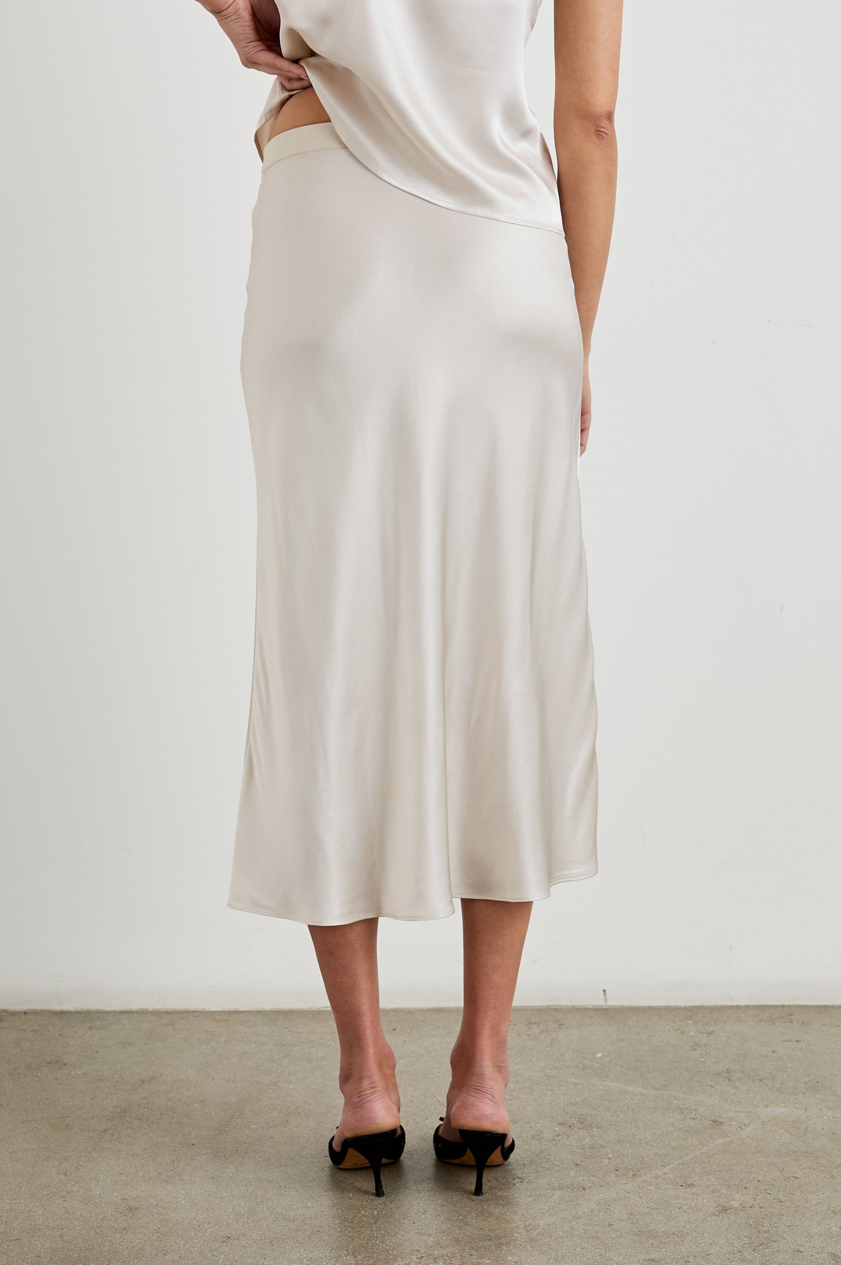 Berlin Midi Skirt in Ivory Colorway - Back View Featured on Model