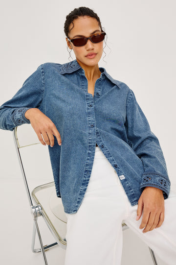 Bethany Button-Up Shirt in TENCELâ„¢ Denim With an Embroidered Collar Long Sleeves and Loose Fit in Antique Blue Colorway - Upper Body Front View Featured on Model