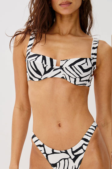 Bianca Underwire Top, Fixed Straps With 3-Point Adjustable Clip Back, Zebra Print, U Front, Paneled Cup in White and Black Abstract Playa Blanca Colorway. Front Detailed View Shown on Model.