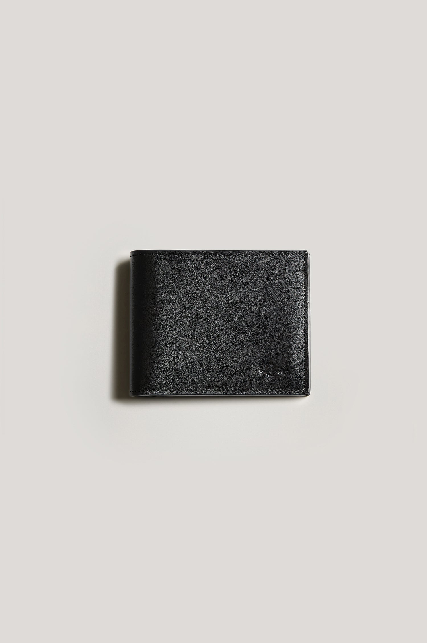 Leather wallet in black color, folded. Front view featured.