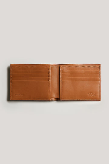 Leather wallet in cognac color, open. Inside view featured.
