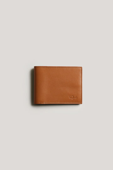 Leather wallet in cognac color, folded. Front view featured.