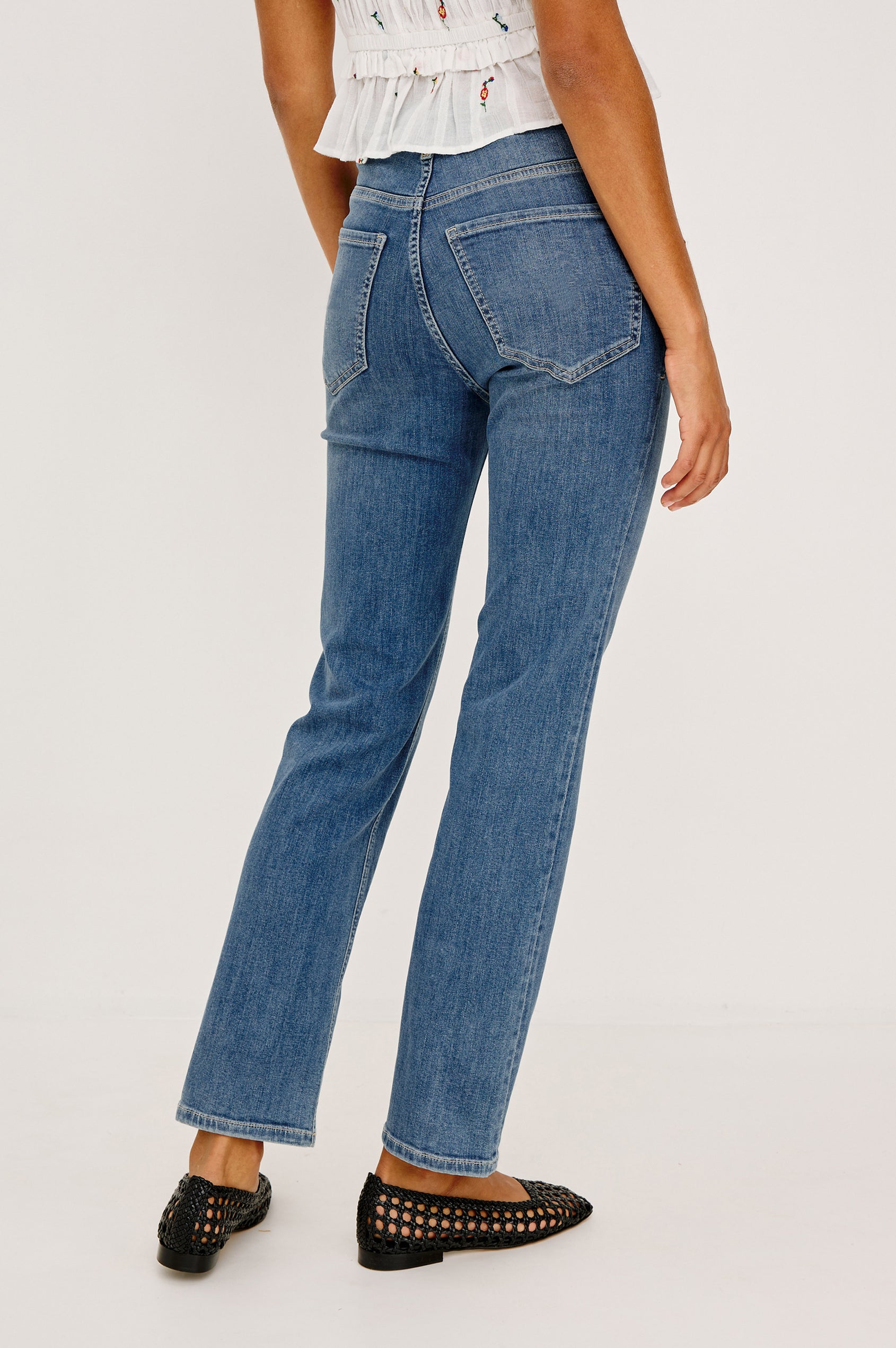 Bixby Mid-Rise Slim Straight Jean in High Stretch Denim With 25″ Inseam, Zip Fly, and 5-Pockets in East Coast Colorway - Lower Body Back View Featured on Model