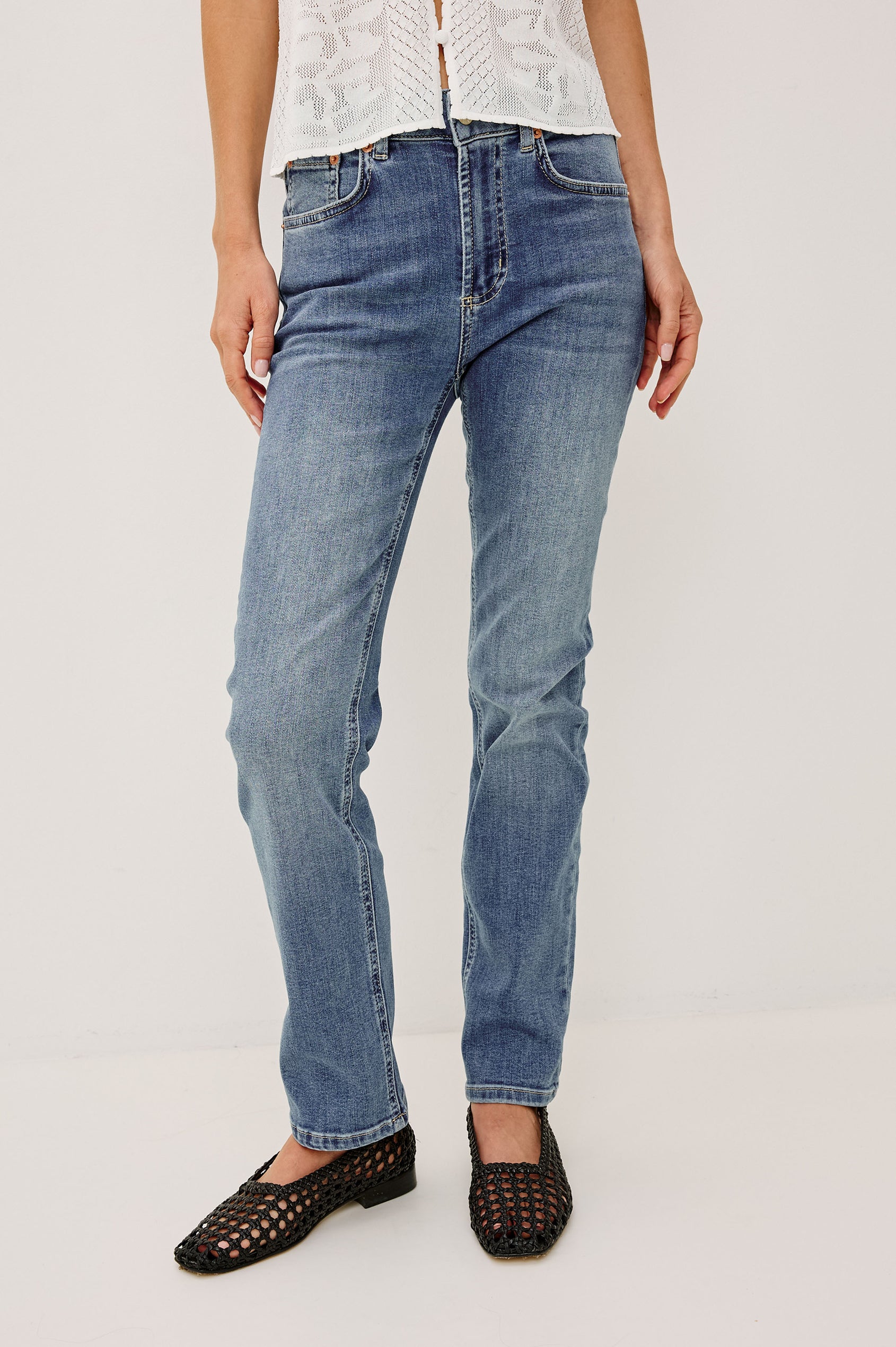 Bixby Petite Slim Straight Jean in High Stretch Denim With Mid-Rise, Zip Fly, and 5-Pockets in Vista Blue Colorway - Lower Body Front View Featured on Model