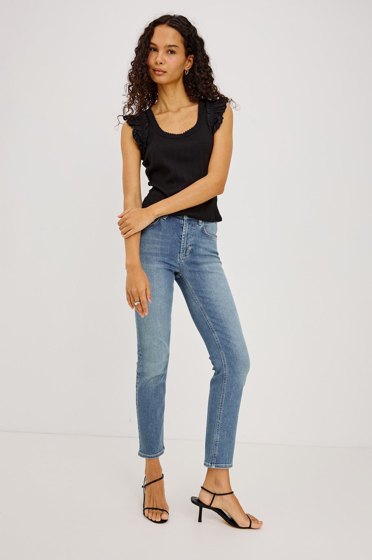 Bixby Slim Jean in High-Stretch Denim With Mid-Rise, Slim Legs, Zip Fly, and Ankle-Length Inseam in Vista Blue Colorway - Full Body Front View Featured on Model
