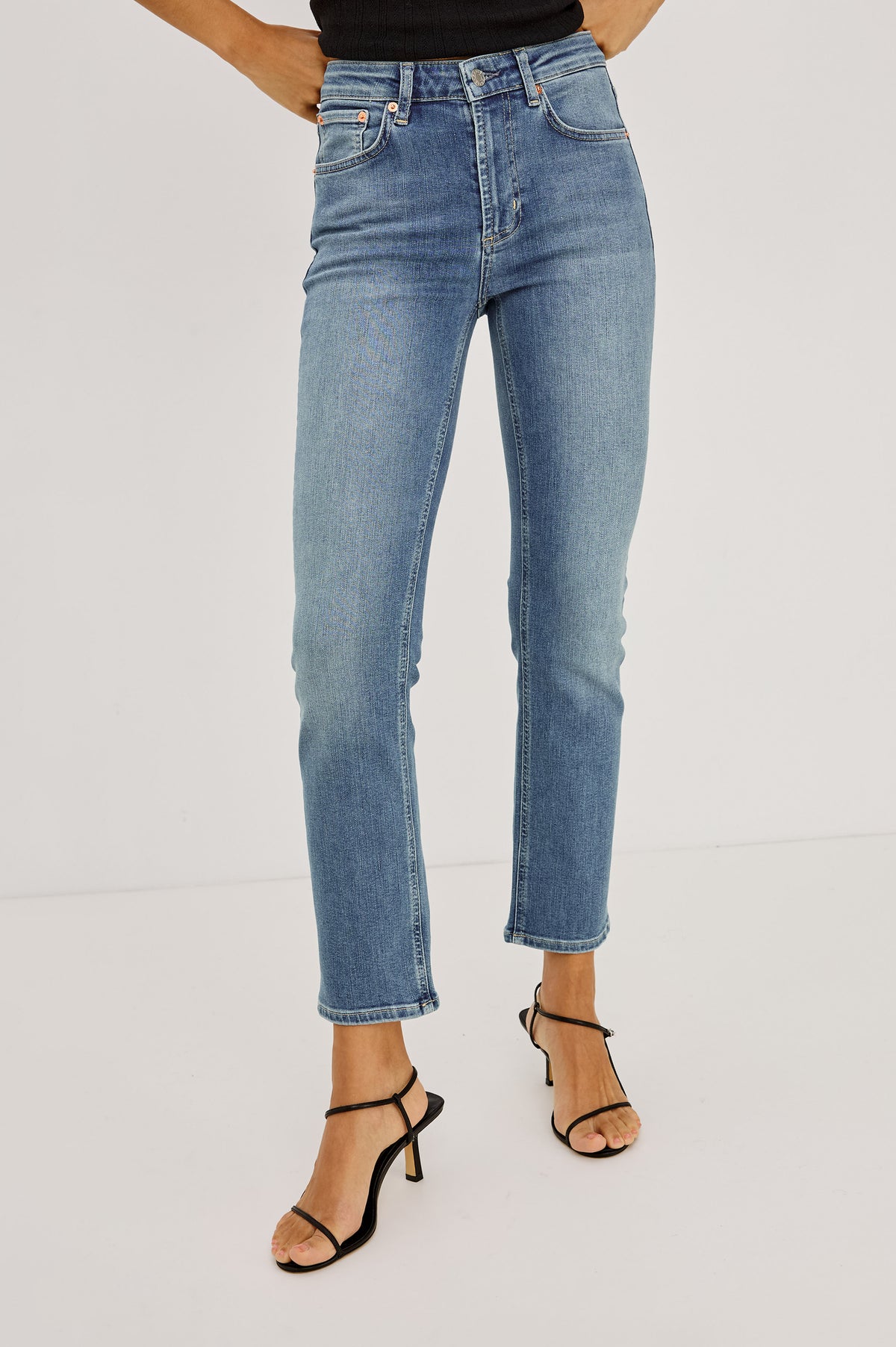 Bixby Slim Jean in High-Stretch Denim With Mid-Rise, Slim Legs, Zip Fly, and Ankle-Length Inseam in Vista Blue Colorway - Lower Body Front View Featured on Model