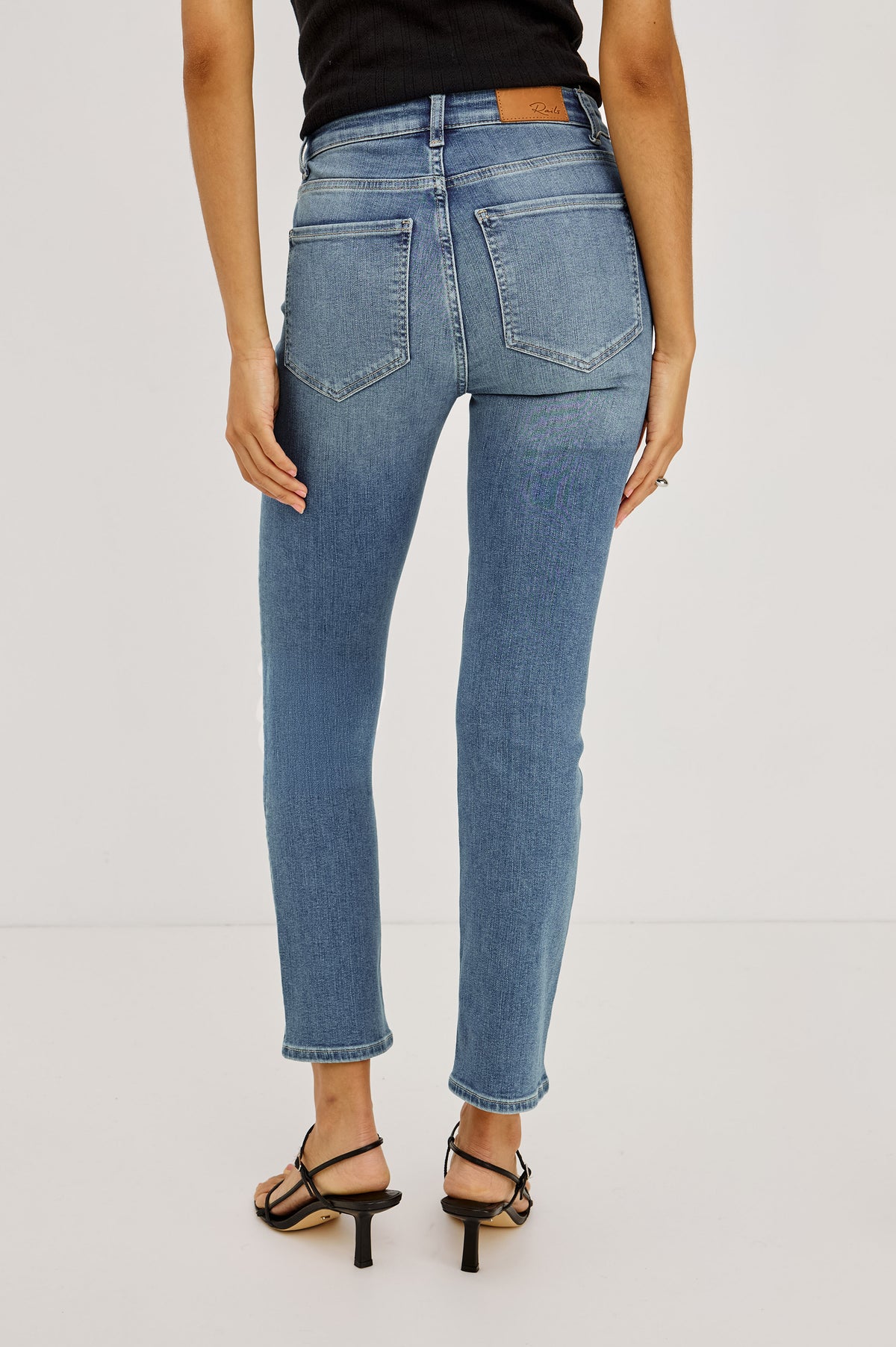 Bixby Petite Slim Jean in High-Stretch Denim With Mid-Rise, Slim Legs, Zip Fly, and Ankle-Length Inseam in Vista Blue Colorway - Lower Body Close Up Front View Featured on Model