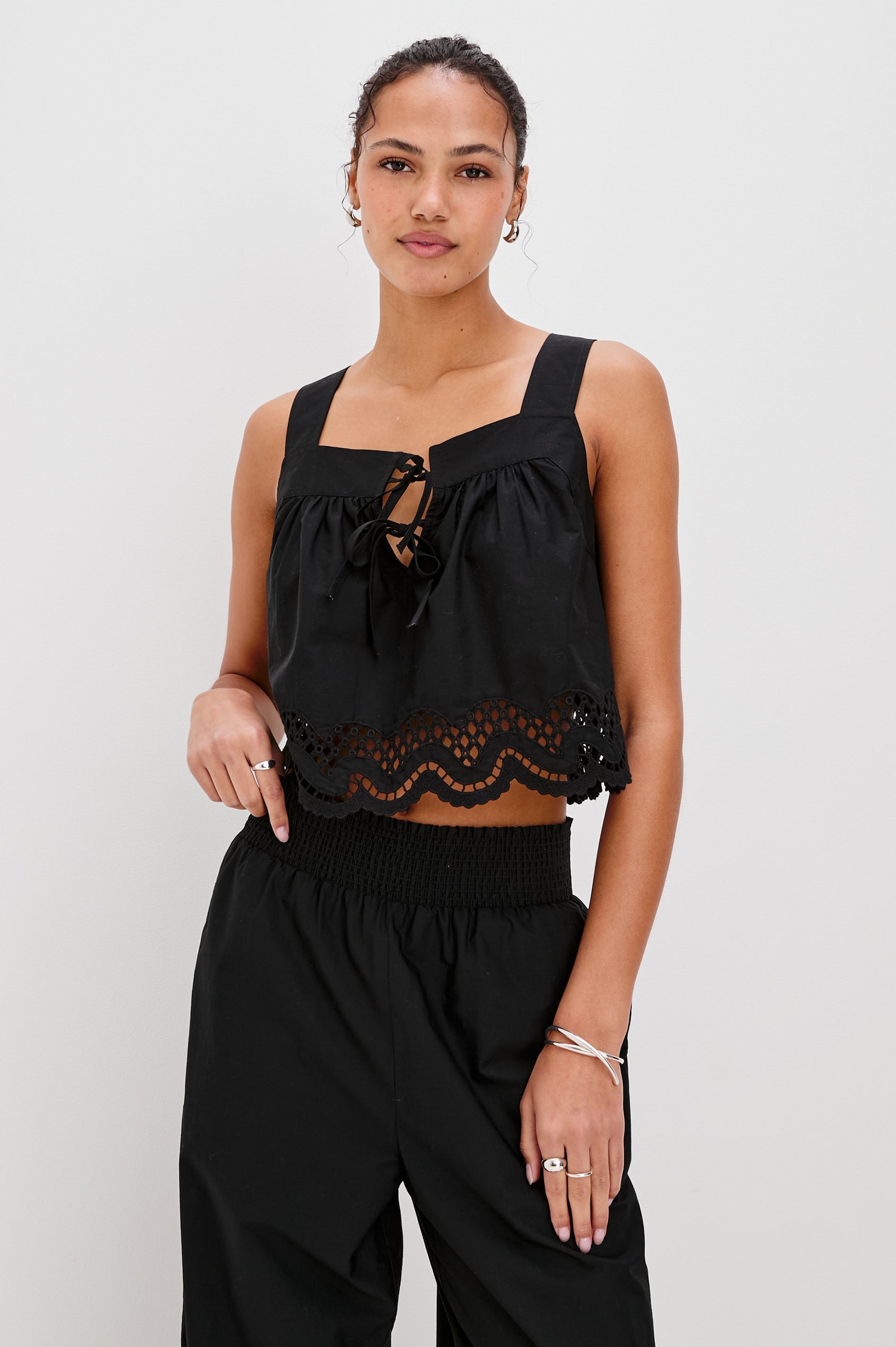 Blythe Square Neck Tank with Wide Straps, Two Front Ties and a Scalloped Hem in Black Colorway. Front View Shown on Model.