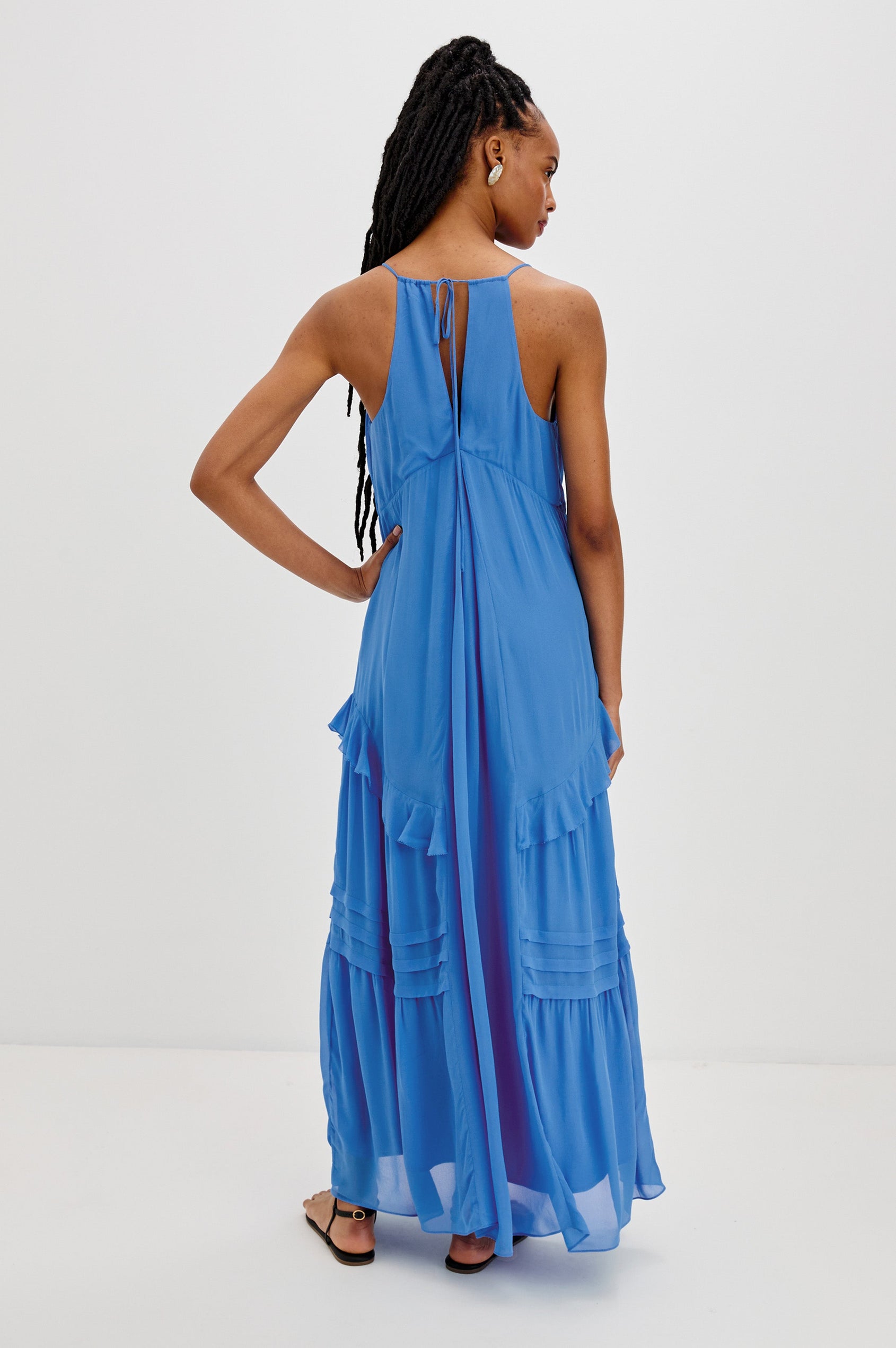 Boa Maxi Tank Dress with Spaghetti Straps, a V-Neck and Ruffle Details in French Blue Colorway. Full Body Back View Shown on Model.