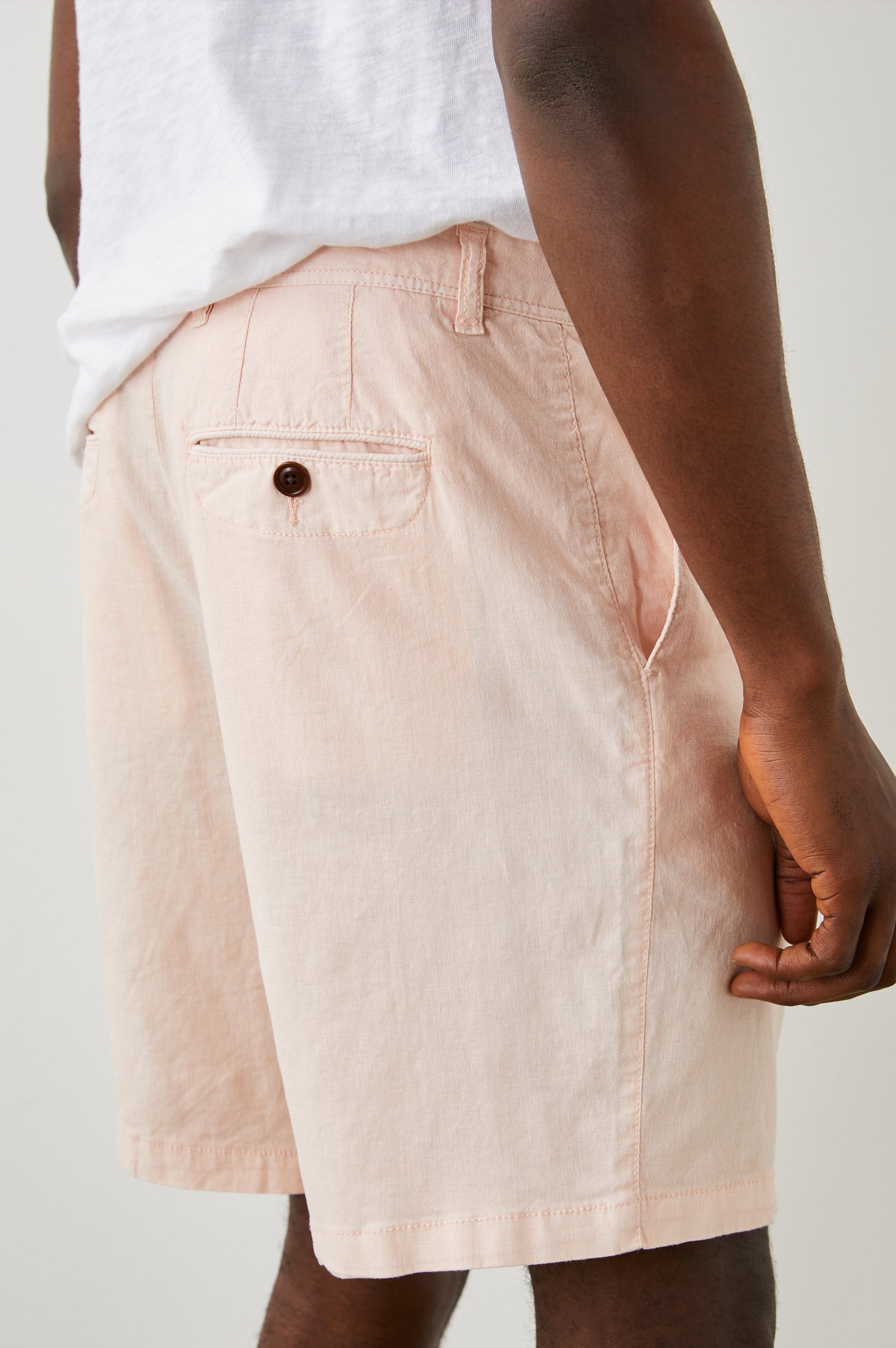 Boden Knee-Length Shorts with Belt Loops, Two Front Pockets and Two Back Button Welt Pockets in Prawn Colorway - Back View Featured on Model