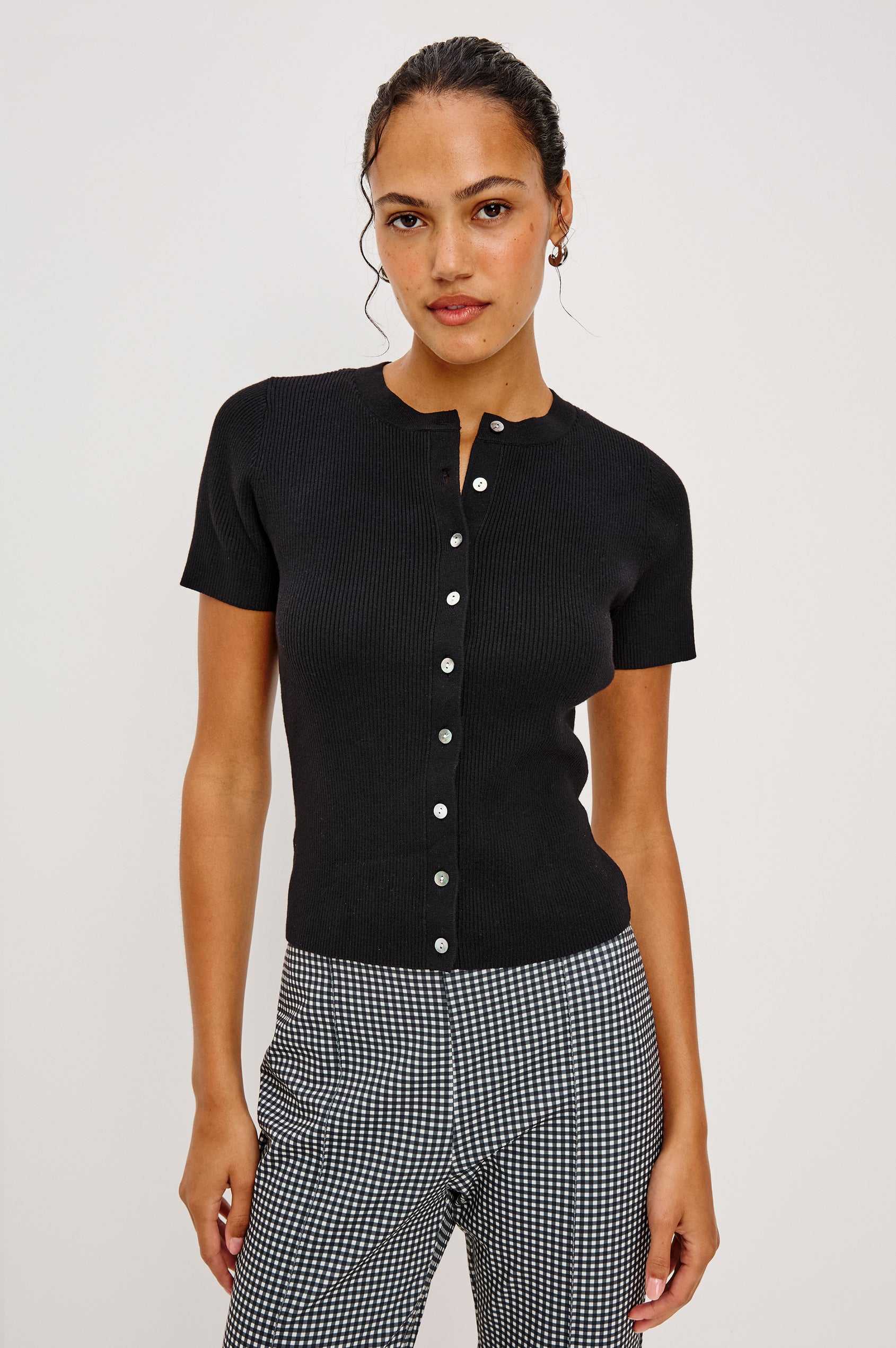 Bonnie Fitted Top in Ribbed Cotton With Crew Neckline Short Sleeves and Front Buttons in Black Colorway - Upper Body Front View Featured on Model