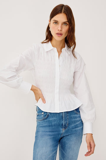 Bradshaw Button-Up Shirt in Cotton Poplin With Collar, Smocked Body, Peplum Hem, and Long Gathered Sleeves in White Colorway - Upper Body Front View Featured on Model