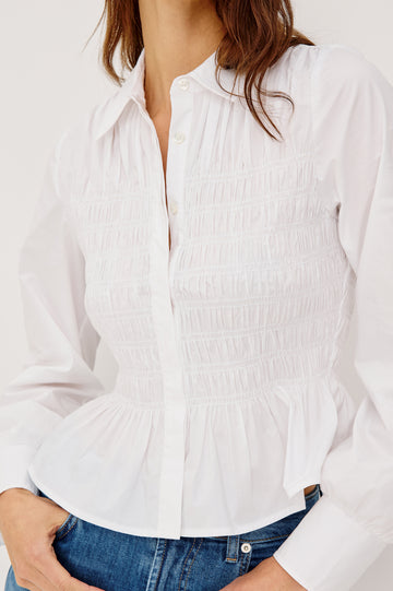 Bradshaw Button-Up Shirt in Cotton Poplin With Collar, Smocked Body, Peplum Hem, and Long Gathered Sleeves in White Colorway - Upper Body Front View Featured on Model