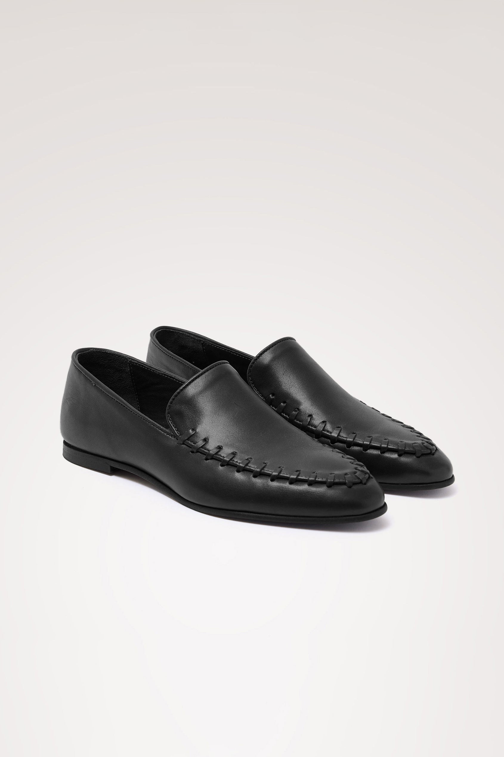 Braga Loafer in Full-Grain Leather With Whipstitch Trim, Narrow Vamp, and Low Heel in Black Colorway - Side Product View Featured