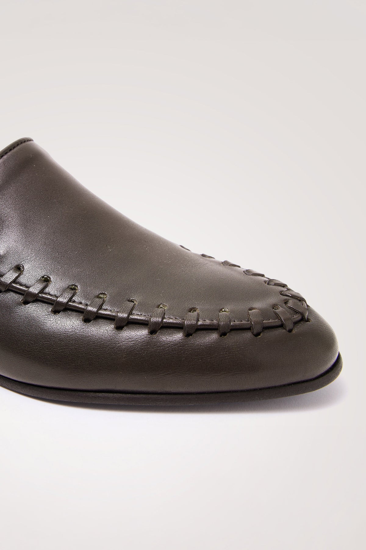 Braga Loafer in Full-Grain Leather With Whipstitch Trim, Narrow Vamp, and Low Heel in Dark Brown Colorway - Side Close Up Product View Featured