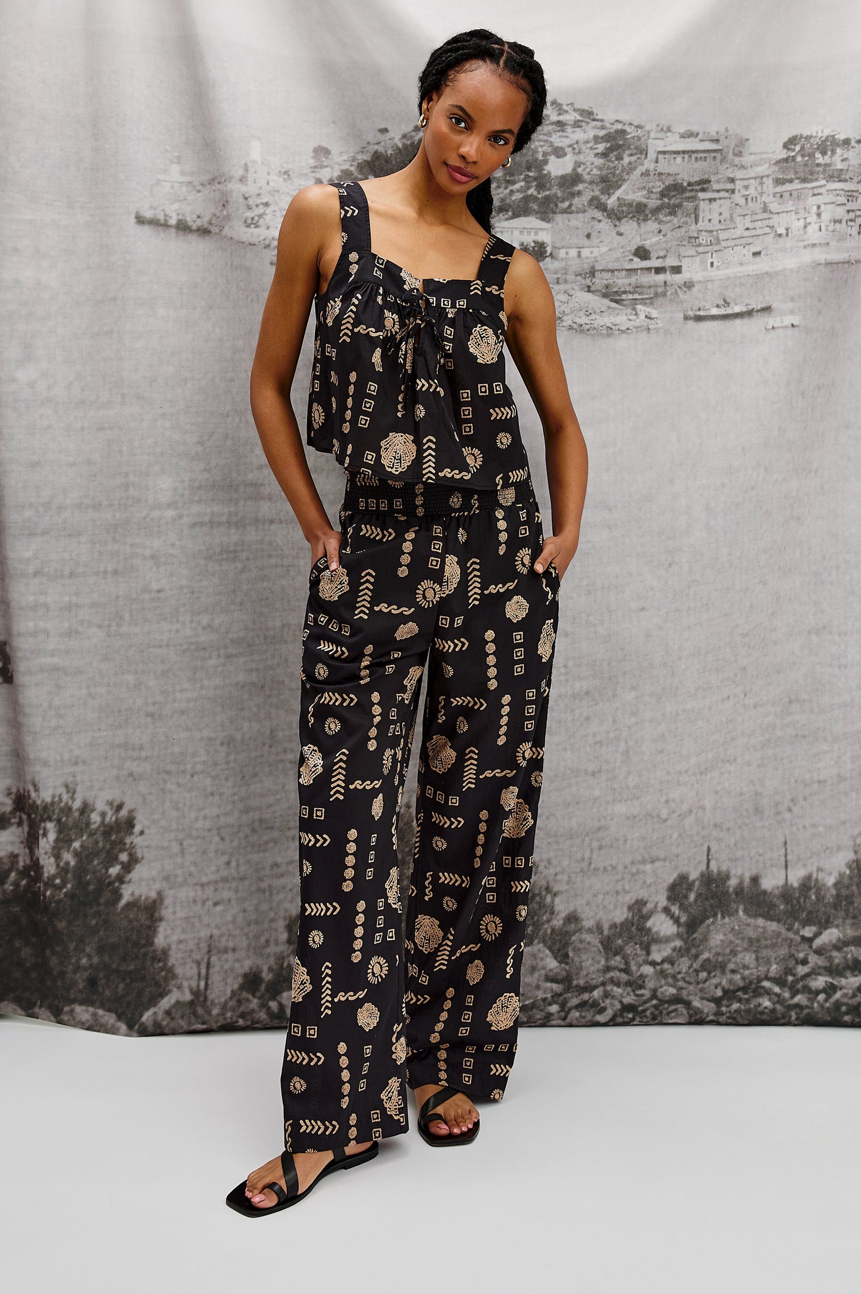 Brendon Pull on Pants with Wide Elastic Gathered Waistband, Relaxed fit and Side Slash Pockets in Beach Shells Colorway. Stylized Full Body Front View Shown on Model.