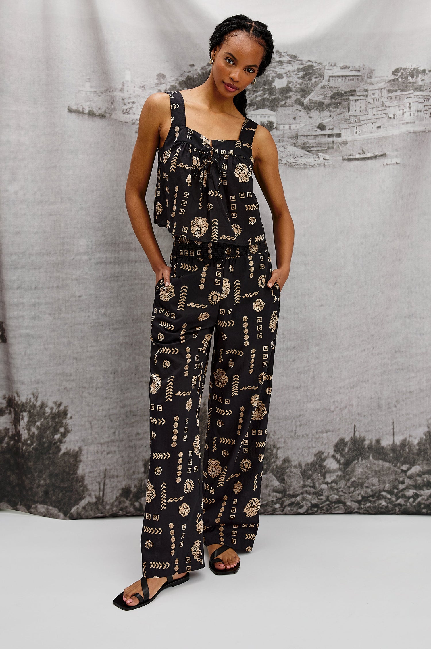 Brendon Pull on Pants with Wide Elastic Gathered Waistband, Relaxed fit and Side Slash Pockets in Beach Shells Colorway. Stylized Full Body Front View Shown on Model.