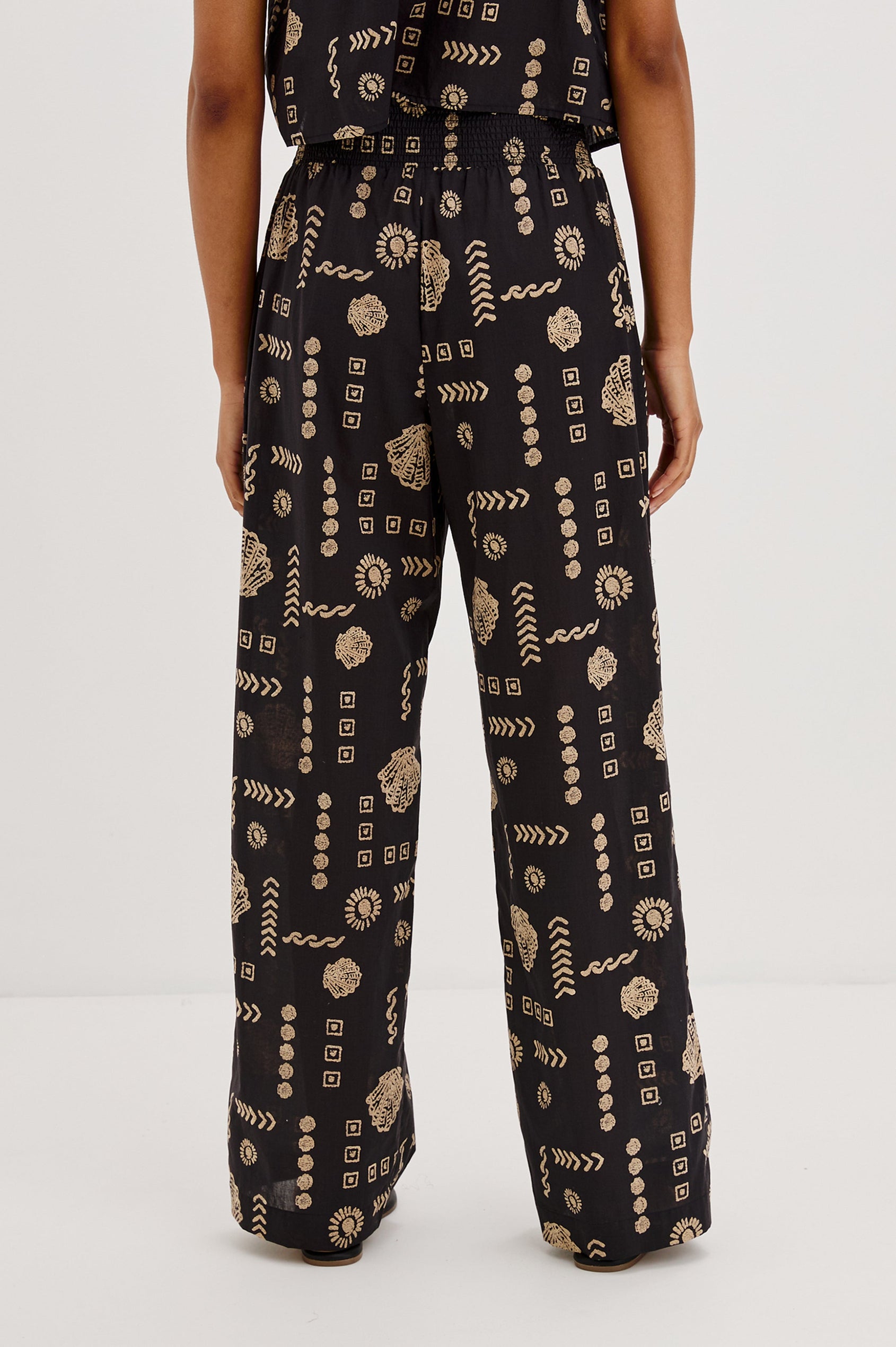 Brendon Pull on Pants with Wide Elastic Gathered Waistband, Relaxed fit and Side Slash Pockets in Beach Shells Colorway. Back View Shown on Model.