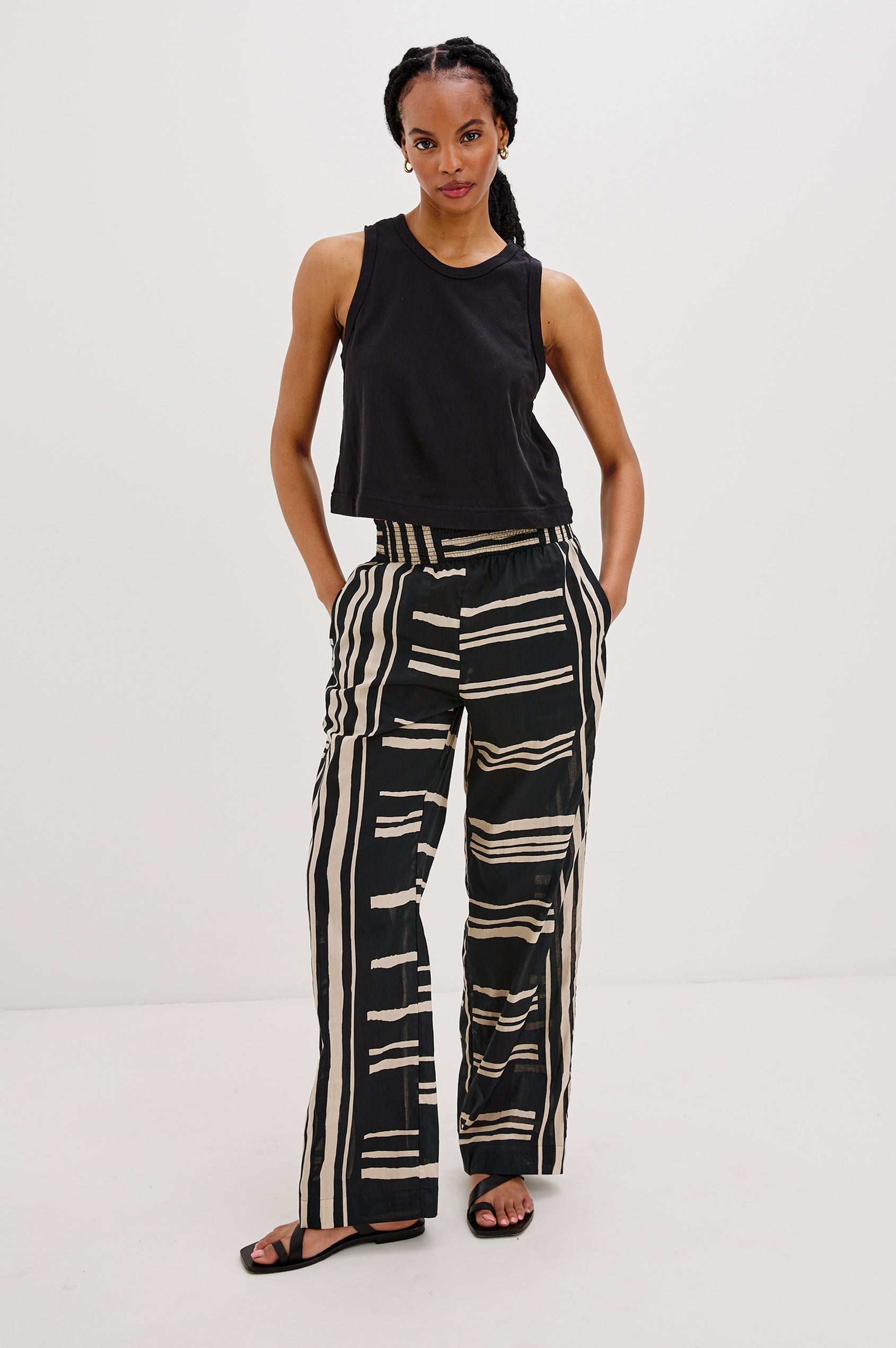 Brendon high-rise Pant with Elastic Waist and two front pockets in Island Stripe Colorway, with white vertical and horizontal stripes on black - Front View Featured on Model