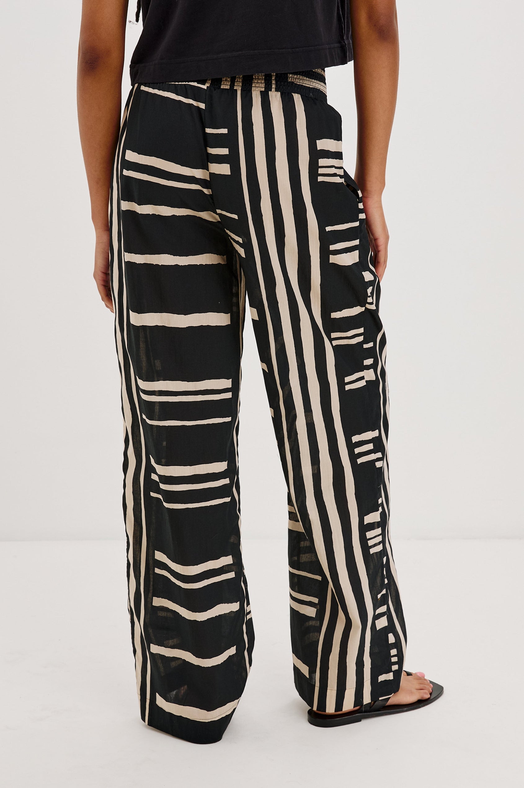 Brendon high-rise Pant with Elastic Waist and two front pockets in Island Stripe Colorway, with white vertical and horizontal stripes on black - Back View Featured on Model