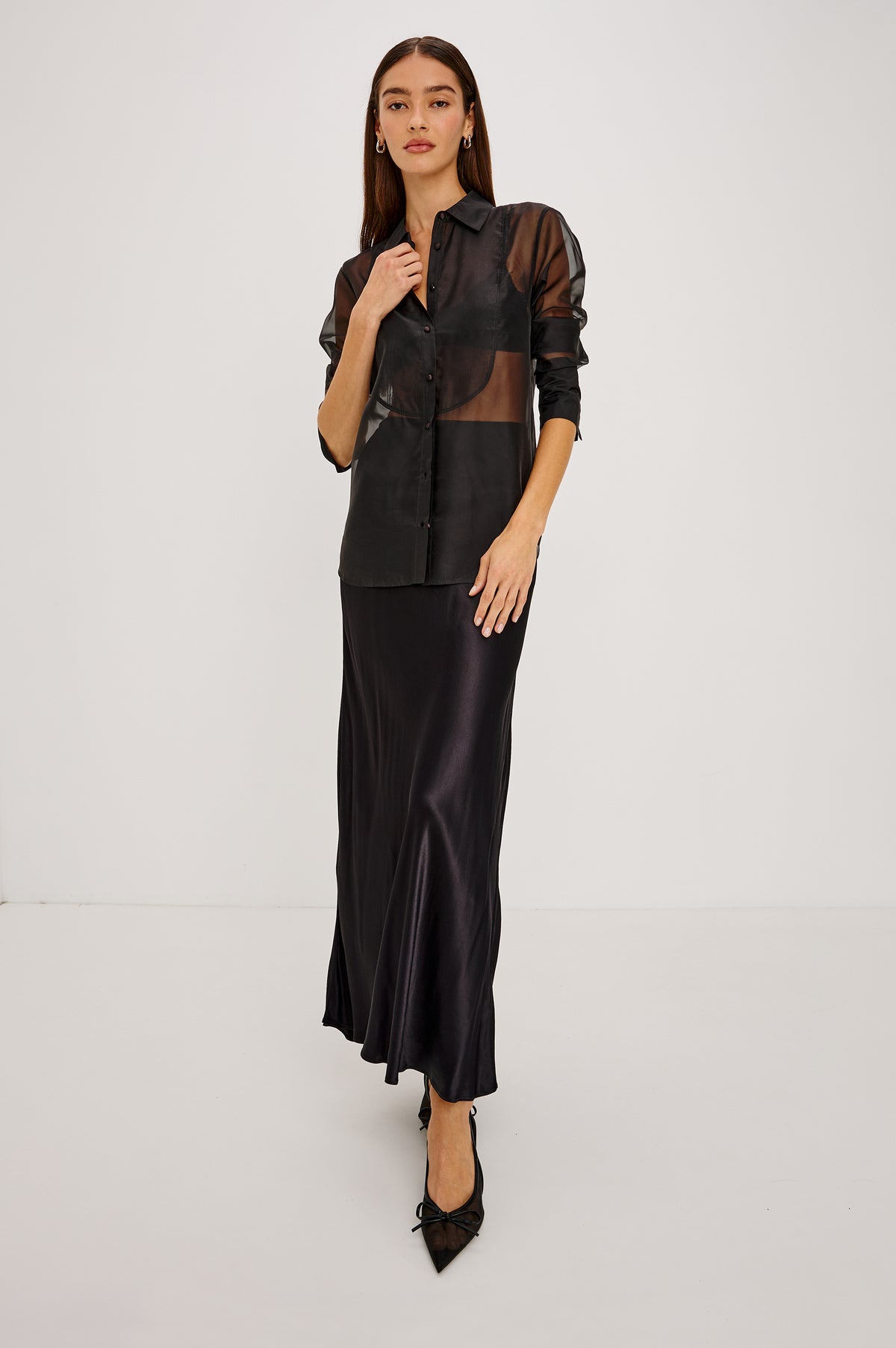 The Bretton Shirt in Sheer Organza With Oversized Fit, Spread Collar, Front Button Placket, and Long Sleeves in Black Organza Colorway - Full Body Front View Featured on Model.