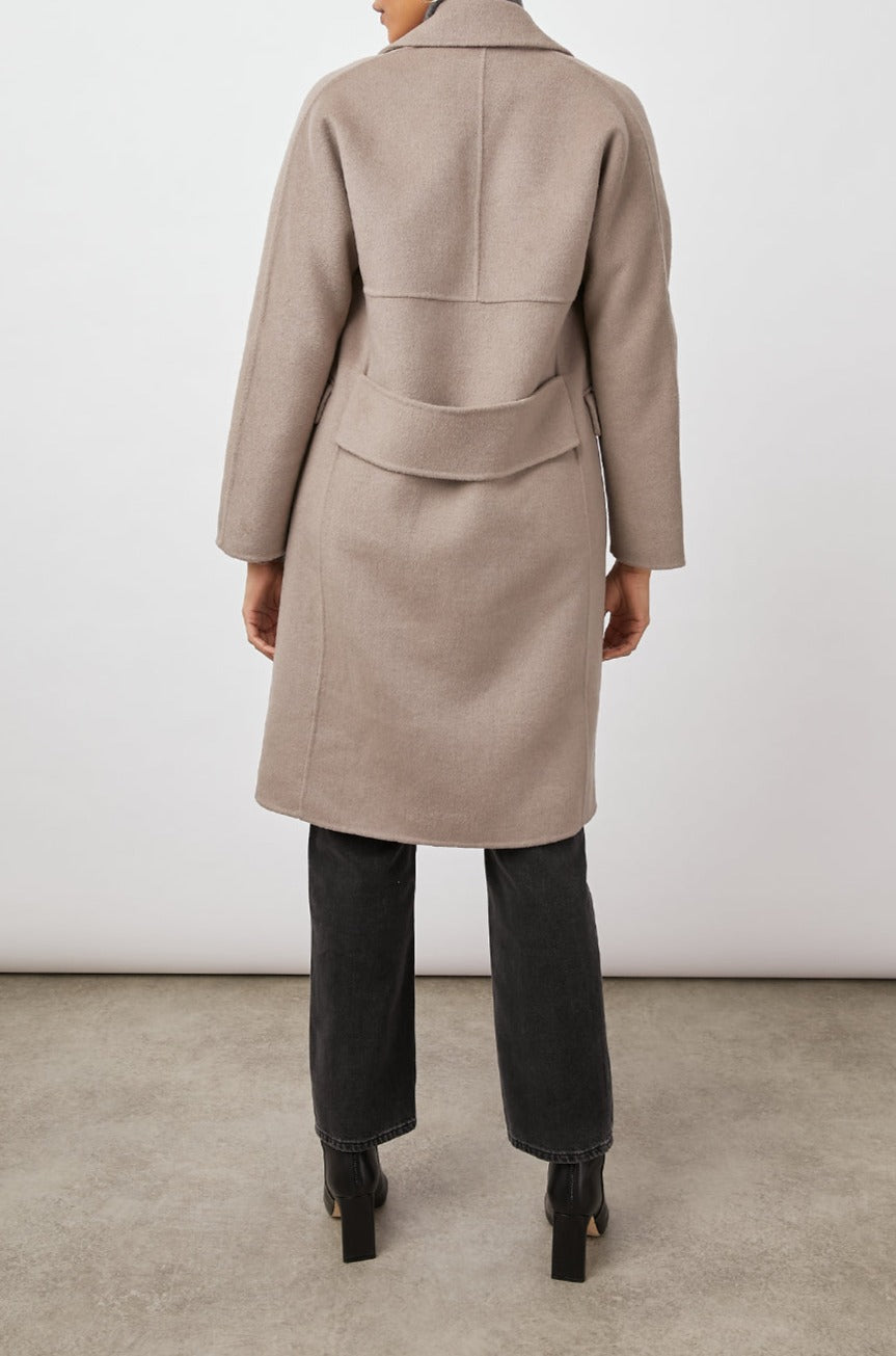 Bristol Knee-Length Double Breasted Coat with Two-Button Closure, Notched Lapels, Two Front Flap Pockets, Center Back Seams, and a Belted Back in Mink Colorway, a Light Brown - Back Full View Featured on Model  
