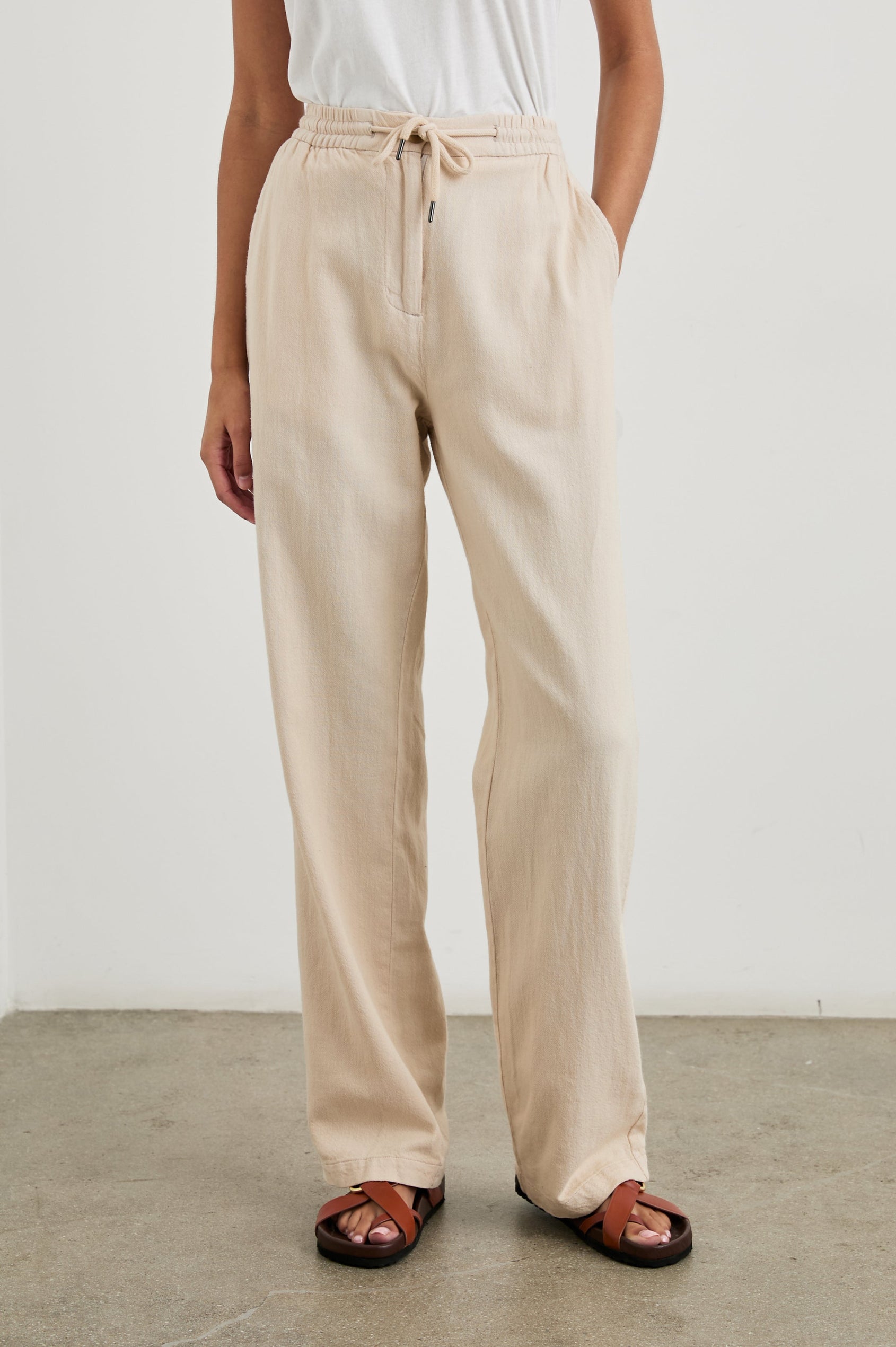 Brooklyn Pants with a Drawcord Elastic Waist, Two Front Pockets and Two Back Welt Pockets in Stone Colorway - Front View Featured on Model