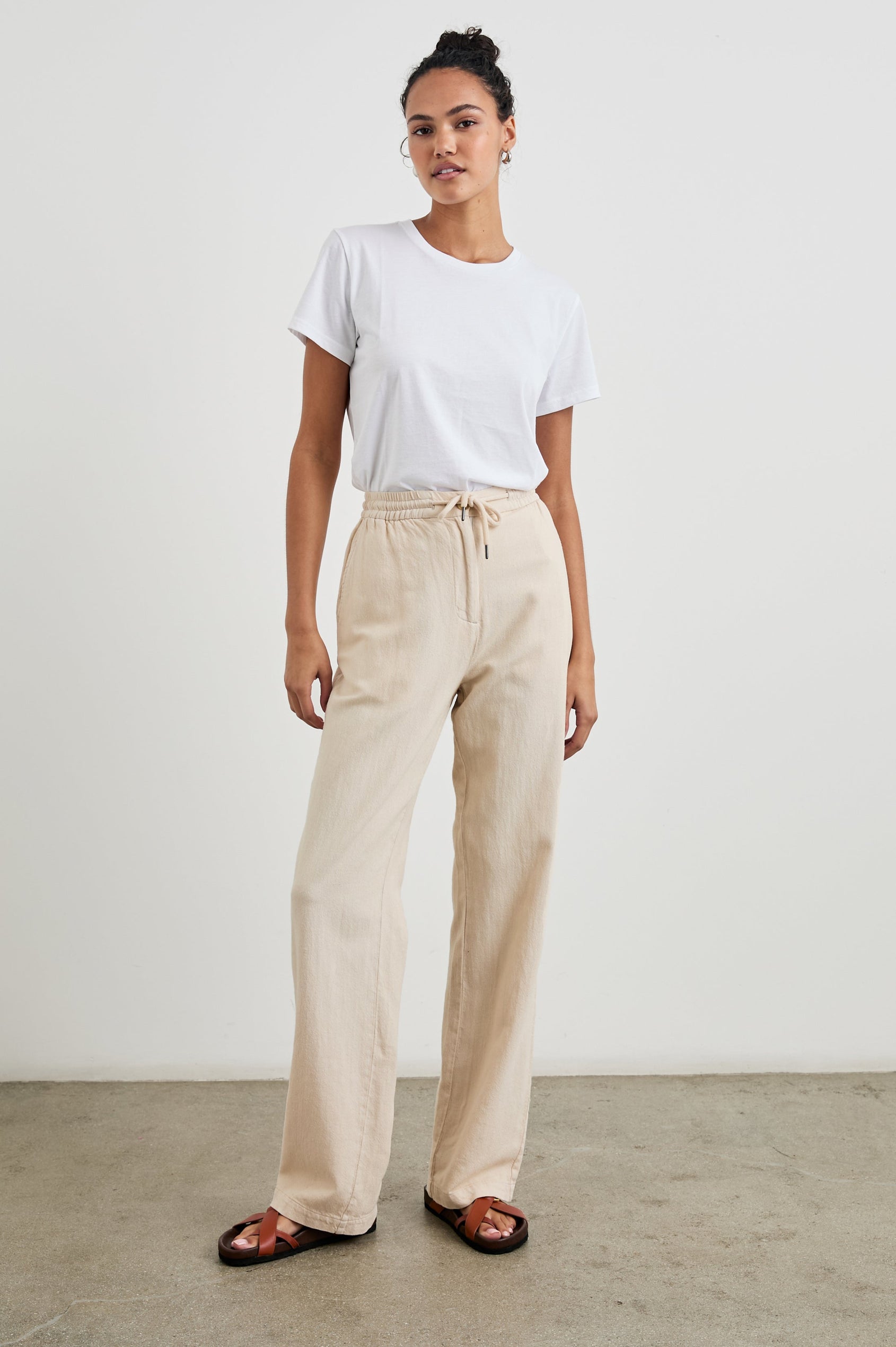 Brooklyn Pants with a Drawcord Elastic Waist, Two Front Pockets and Two Back Welt Pockets in Stone Colorway - Front Full Body View Featured on Model