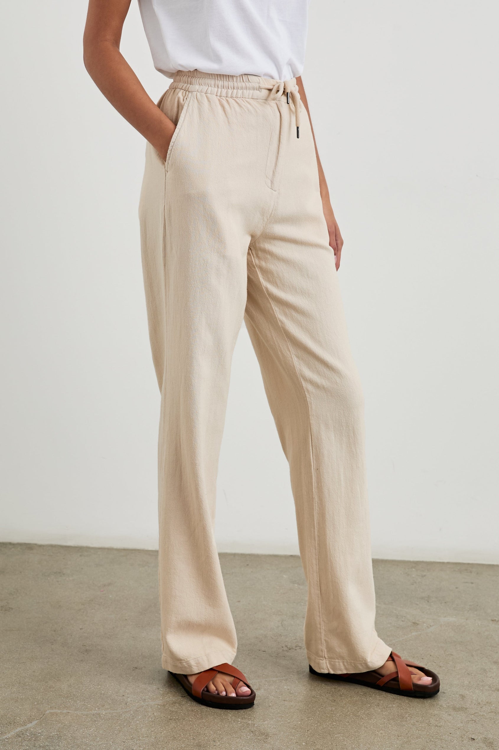 Brooklyn Pants with a Drawcord Elastic Waist, Two Front Pockets and Two Back Welt Pockets in Stone Colorway - Front View Featured on Model