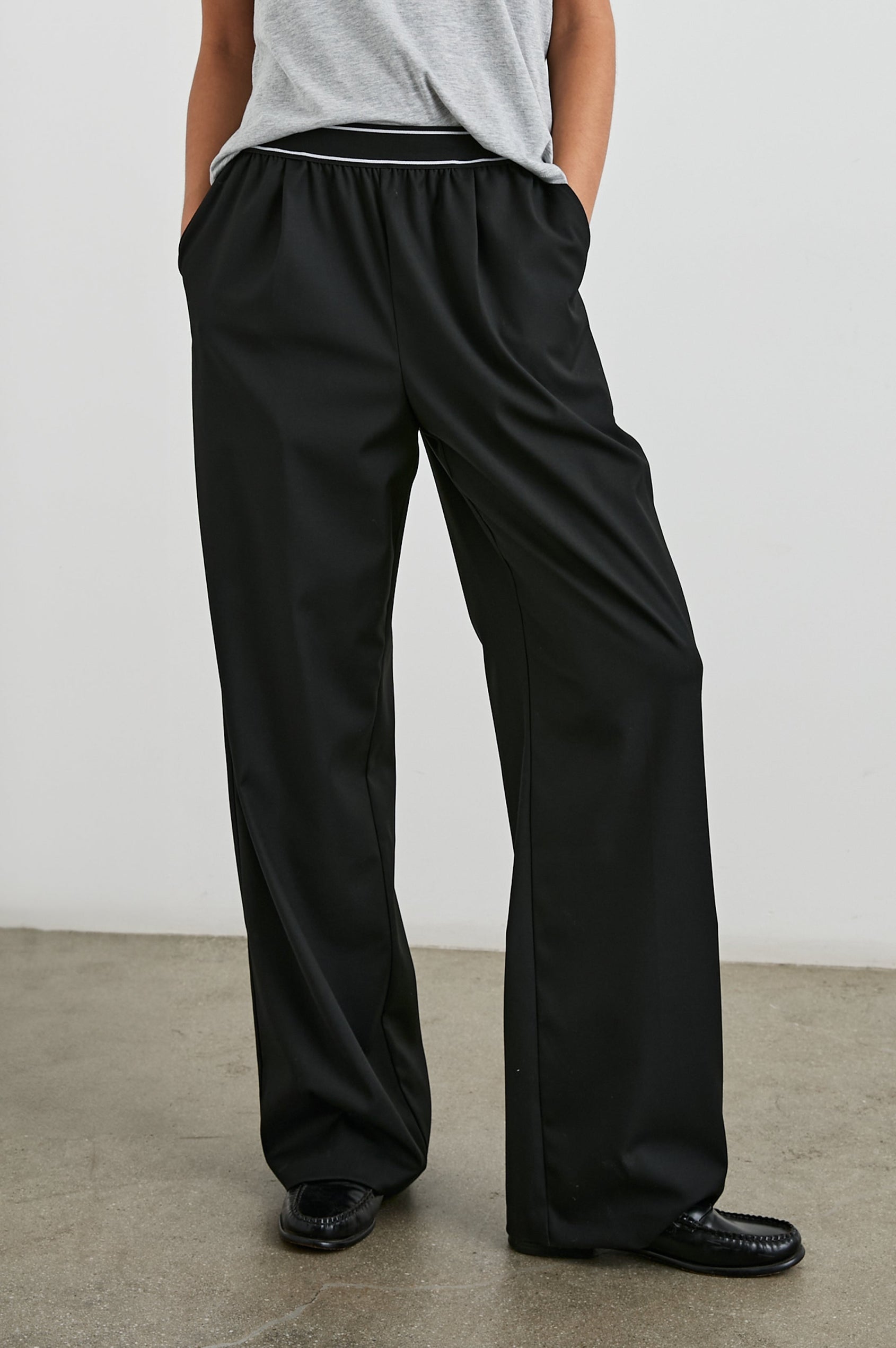 Brynn Pants with Two Front Pockets and Elastic Waist Band with White Trim in Black Colorway - Front View Featured on Model