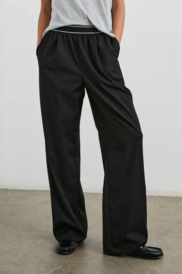 Brynn Pants with Two Front Pockets and Elastic Waist Band with White Trim in Black Colorway - Front View Featured on Model