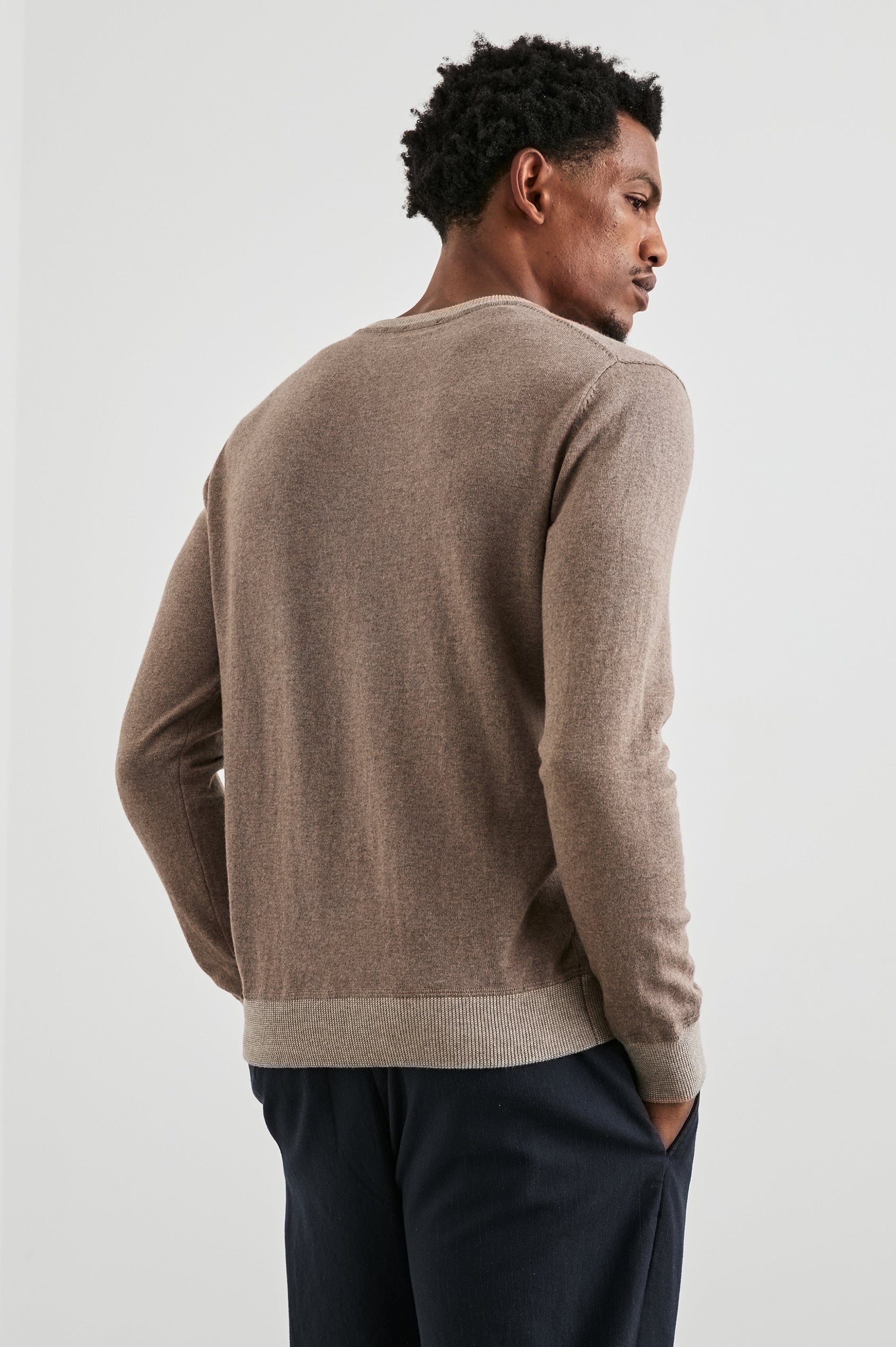 Burns Long-Sleeve Sweater with a Crew Collar and a Lighter Colored Ribbed Trim in Mocha Heather Colorway - Back View Featured on Model