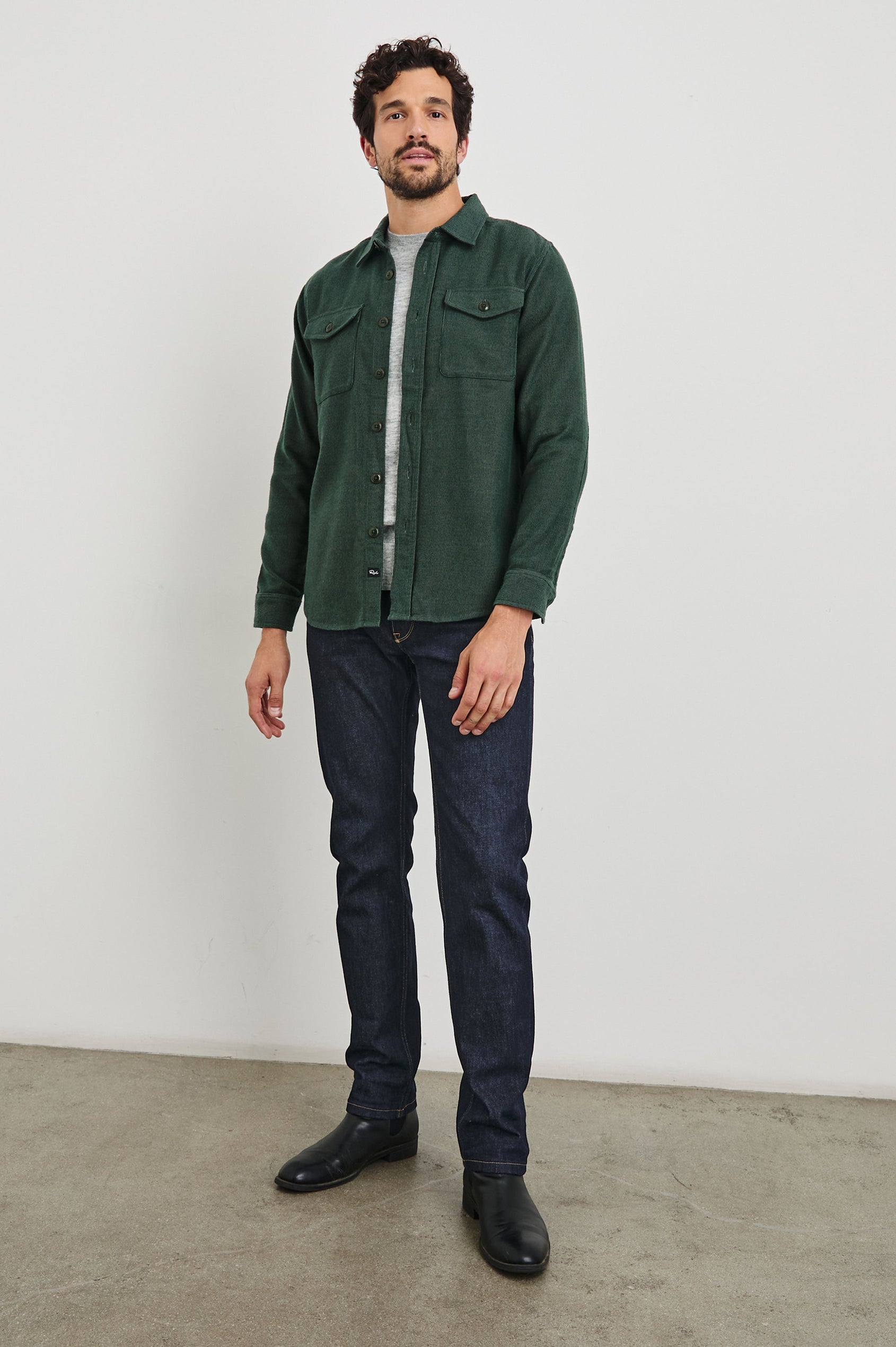 Burr Collared Shirt Jacket with Button Closure, Two Chest Button Flap Pockets and Textured Fabric in Creeping Vine Colorway, a Green - Front Full Body Unbuttoned View Featured on Model