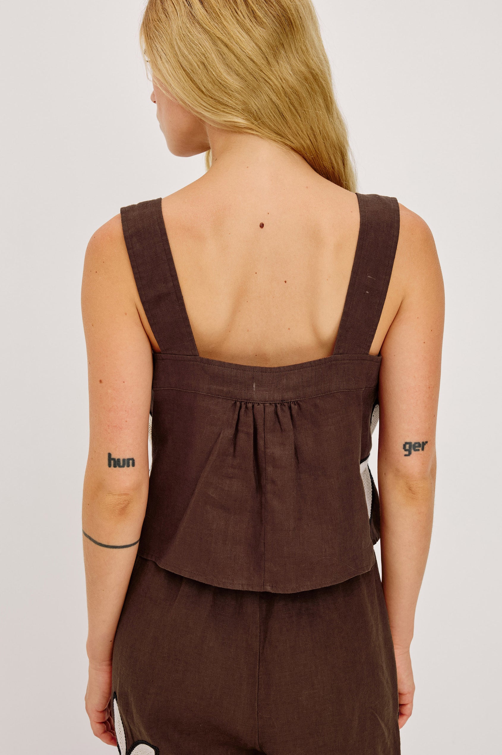 Calais Tank Top in Heavy Linen With Boxy, Loose Relaxed Cropped Fit, Wide Shoulder Straps, and V-Neckline With Adjustable Front Ties in Cocoa Floral Embroidery Colorway - Upper Body Back View Featured on Model