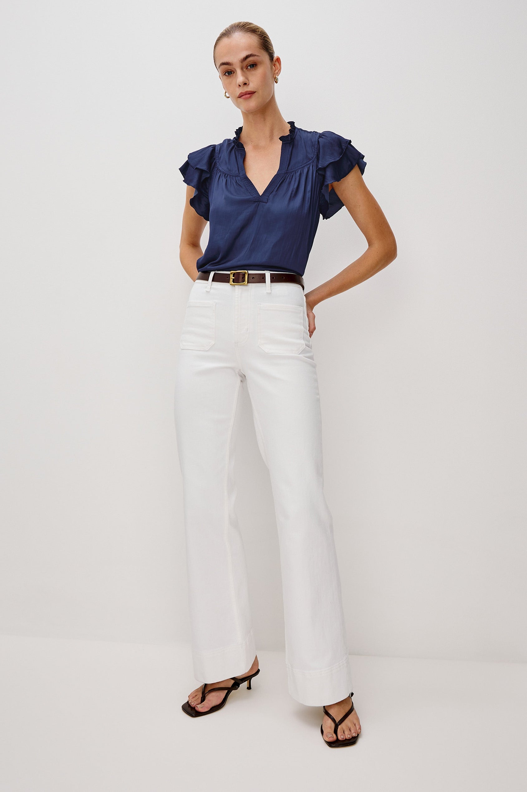 Calista V-Neck Ruffle Sleeve Blouse with a Ruffled Neckline and Gathered Front Yoke in Admiral Blue Colorway. Full Body Front View Shown on Model.