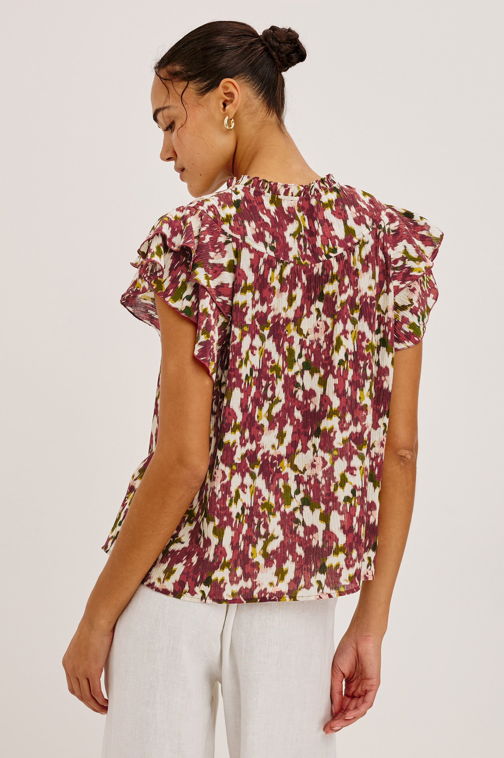Calista Top in Textured Chiffon With Ruffle Trim Split V-Neckline, Layered Flutter Sleeves, and Relaxed Fit in Cardinal Floral Colorway - Upper Body Back View Featured on Model